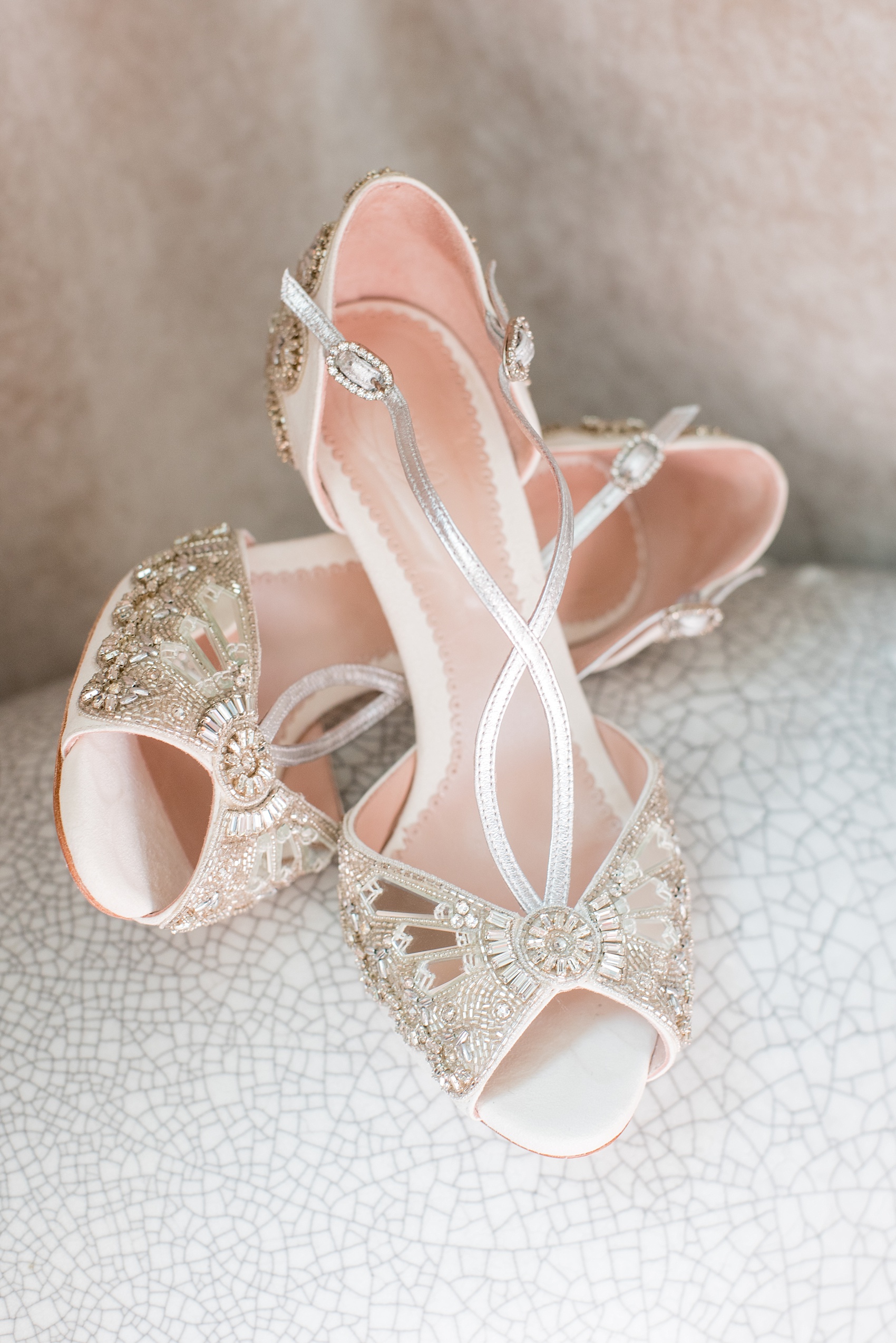 Mikkel Paige Photography captures a luxury wedding in NYC. Detail image of the bride's Emmy London mirrored and silver beaded wedding shoes.