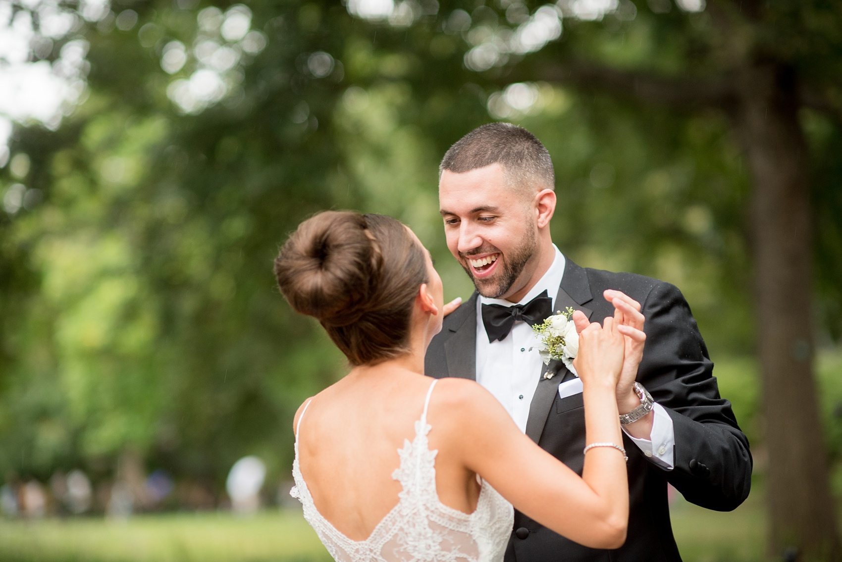 Mikkel Paige Photography photos of a luxury wedding in NYC. First look in Washington Square Park with a picture of the bride in her form fitting David Fielden wedding gown from Kleinfeld's.