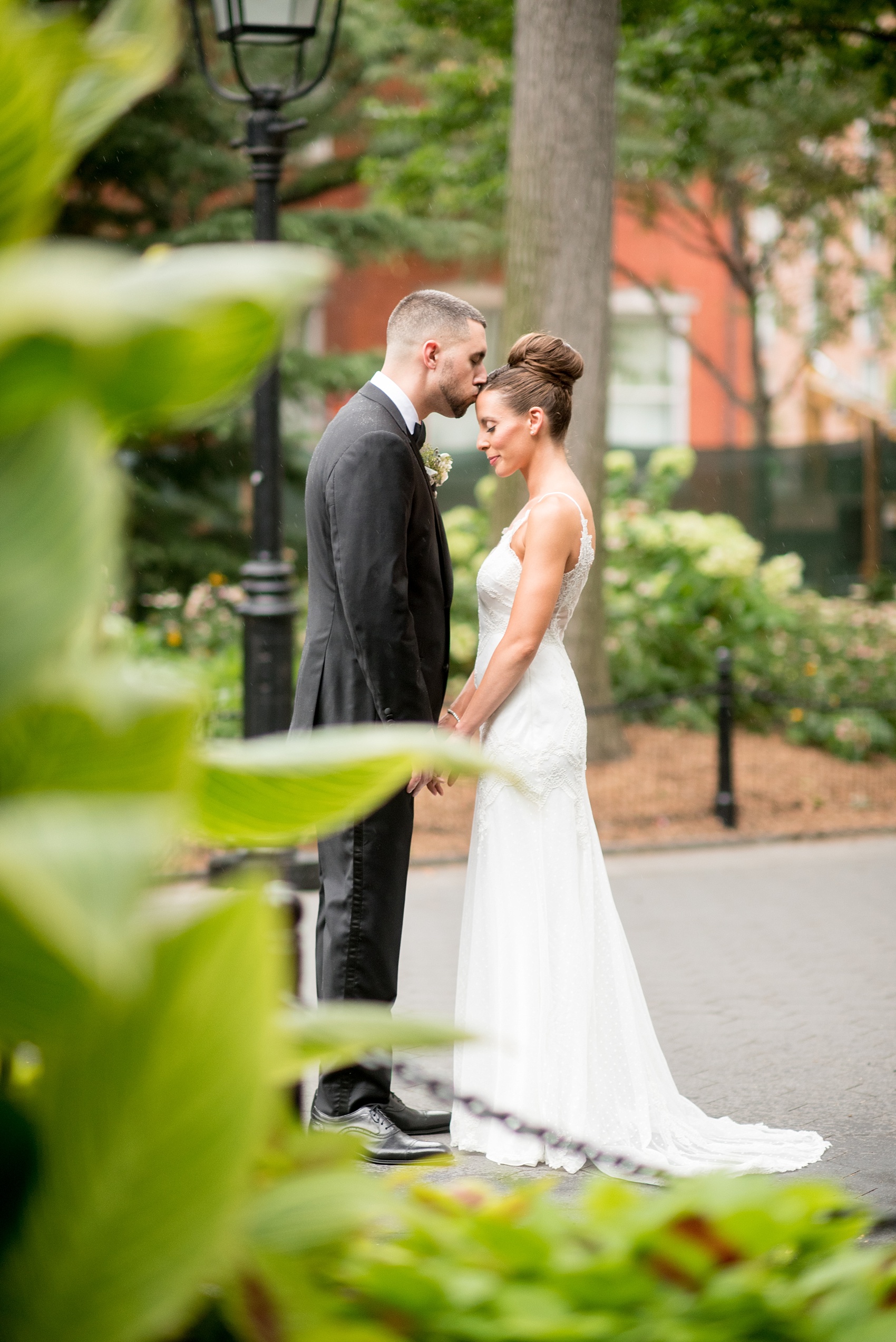 Mikkel Paige Photography photos of a luxury wedding in NYC. Image of the bride and groom in Washington Square Park.