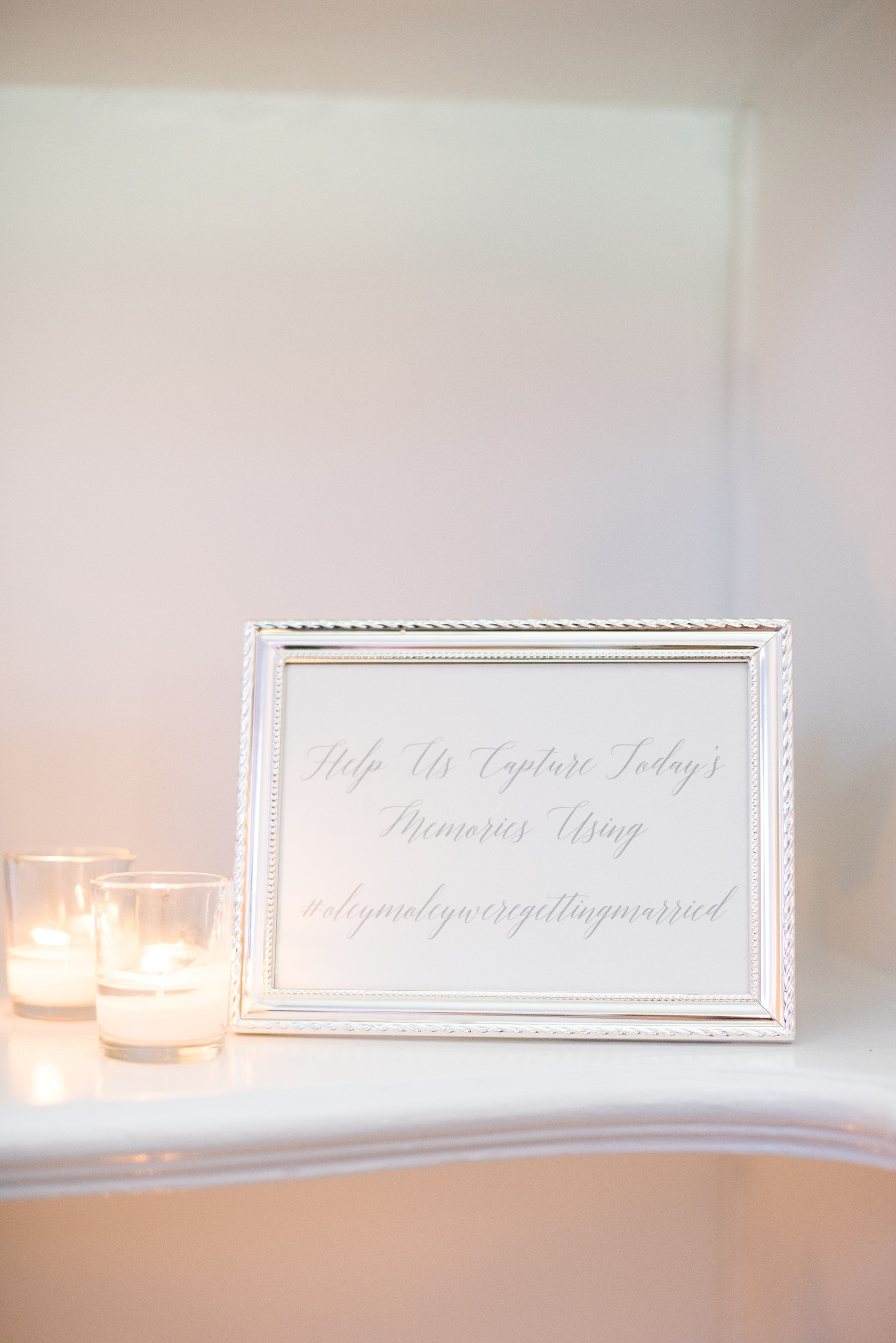 Mikkel Paige Photography photos of a luxury wedding in NYC. Image of the India House reception with calligraphy sign for their hashtag and social media.