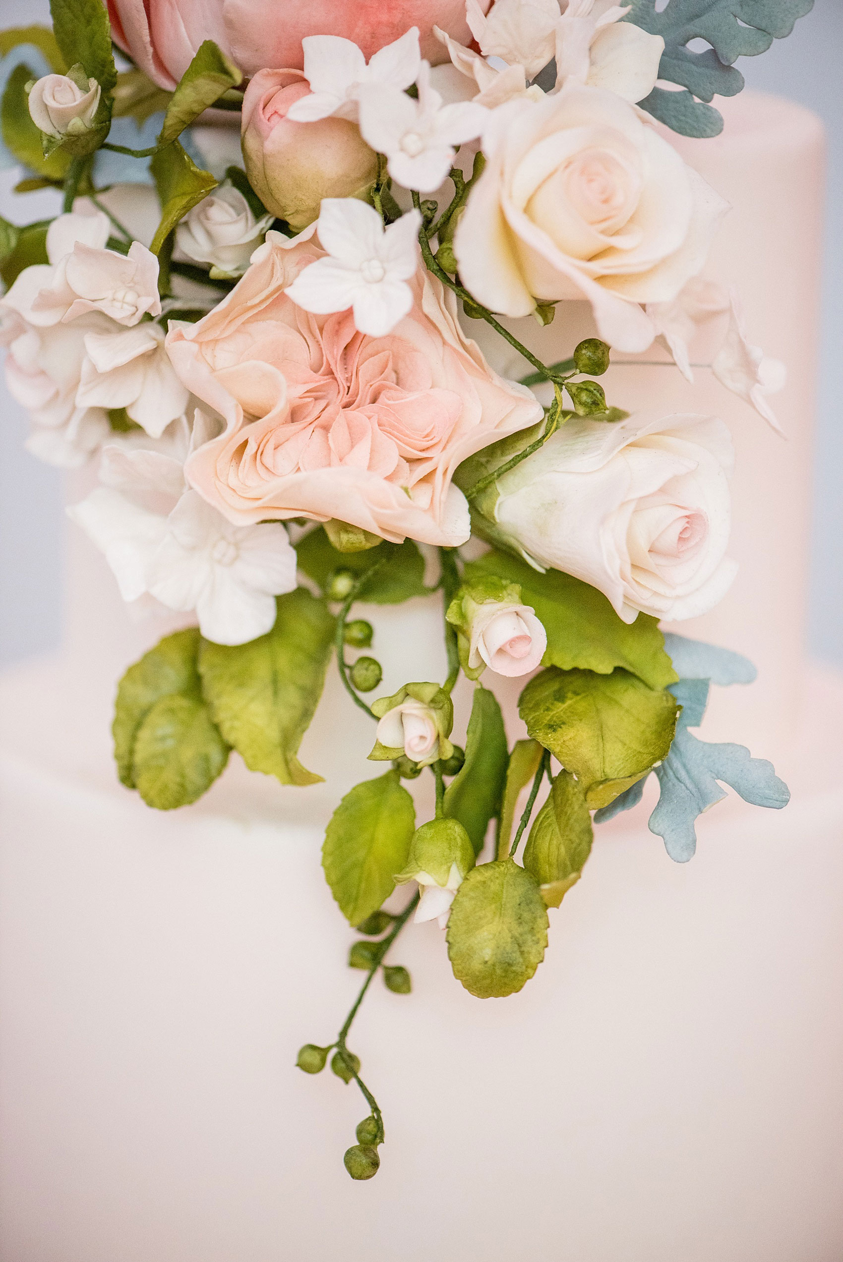 Mikkel Paige Photography photos of a luxury wedding in NYC. Image of India House reception and elegant white tiered cake with gumpaste flowers by Madison Lee.