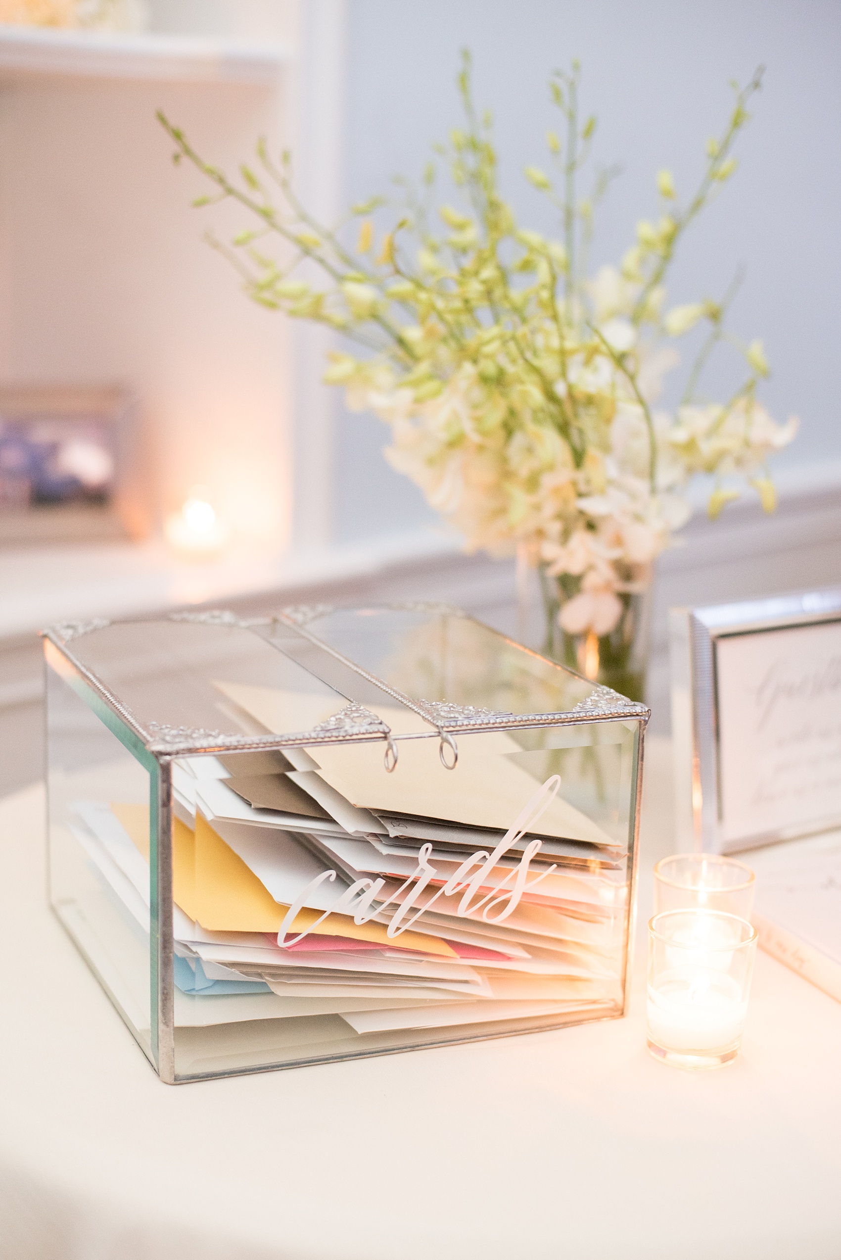 Mikkel Paige Photography photos of a luxury wedding in NYC. Image of the reception details and glass card box in lower Manhattan at India House.