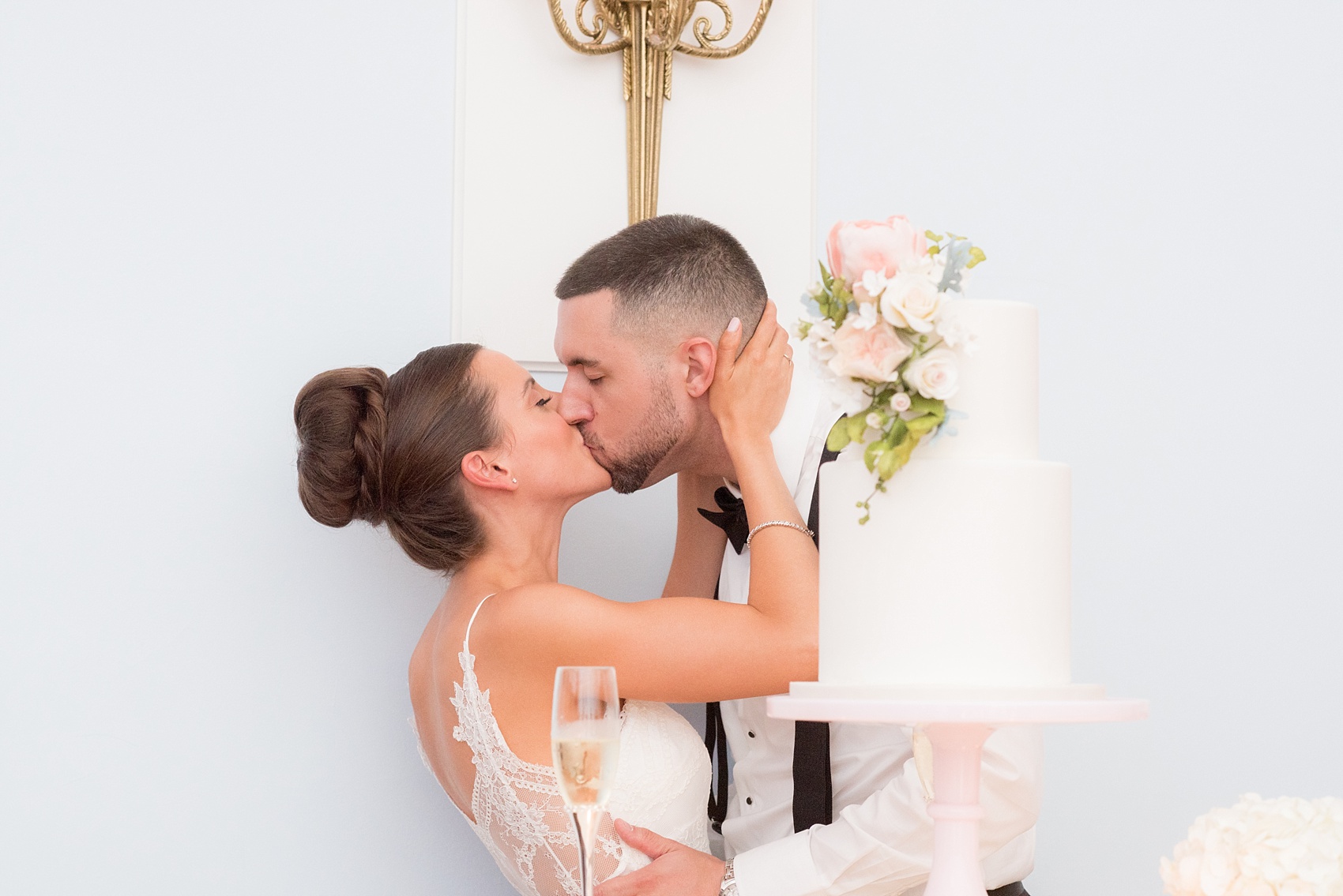 Mikkel Paige Photography photos of a luxury wedding in NYC. Photo of the couple's cake cutting at India House in lower Manhattan.