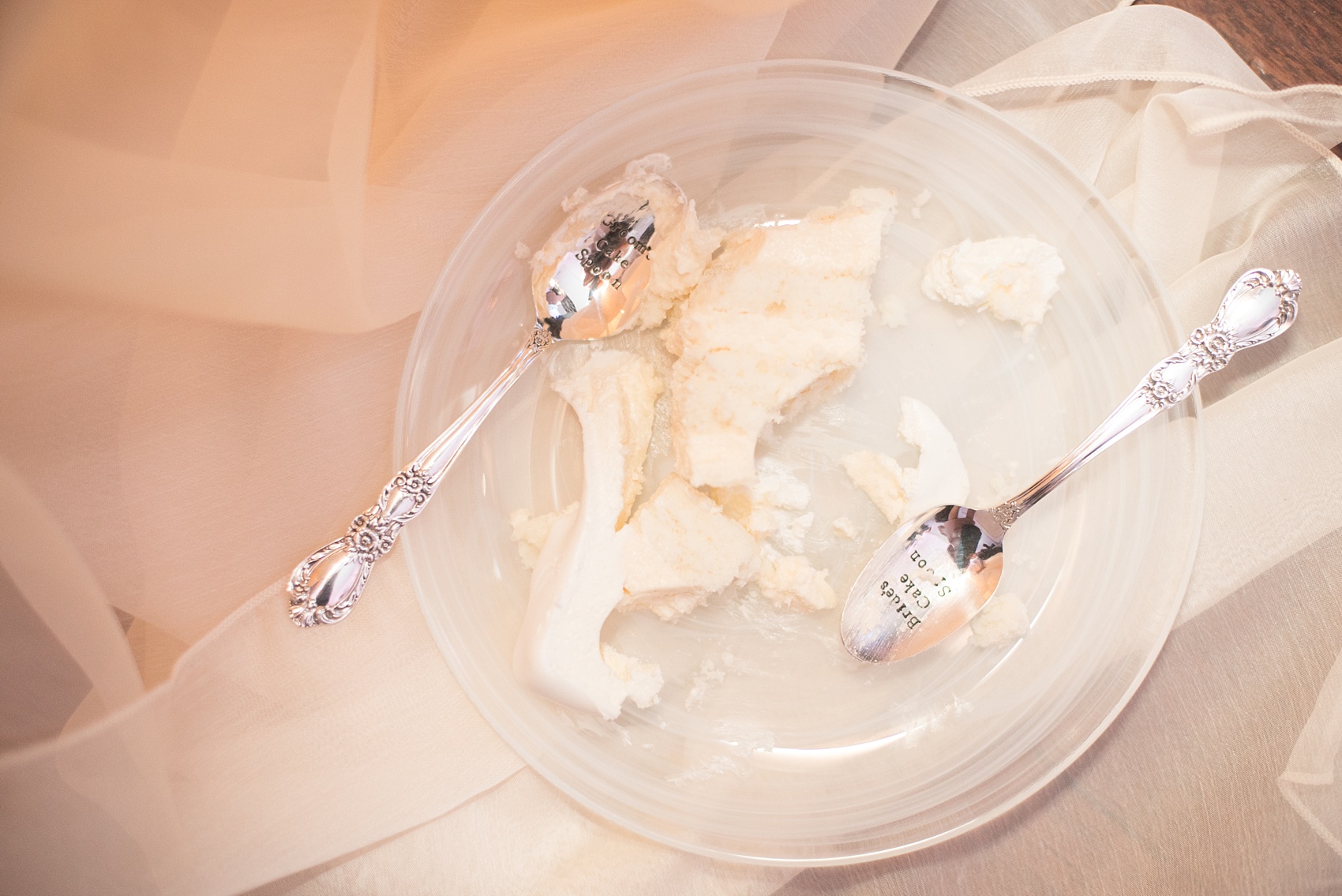 Mikkel Paige Photography photos of a luxury wedding in NYC. Photo of the cake cutting plate and spoons at an India House reception.