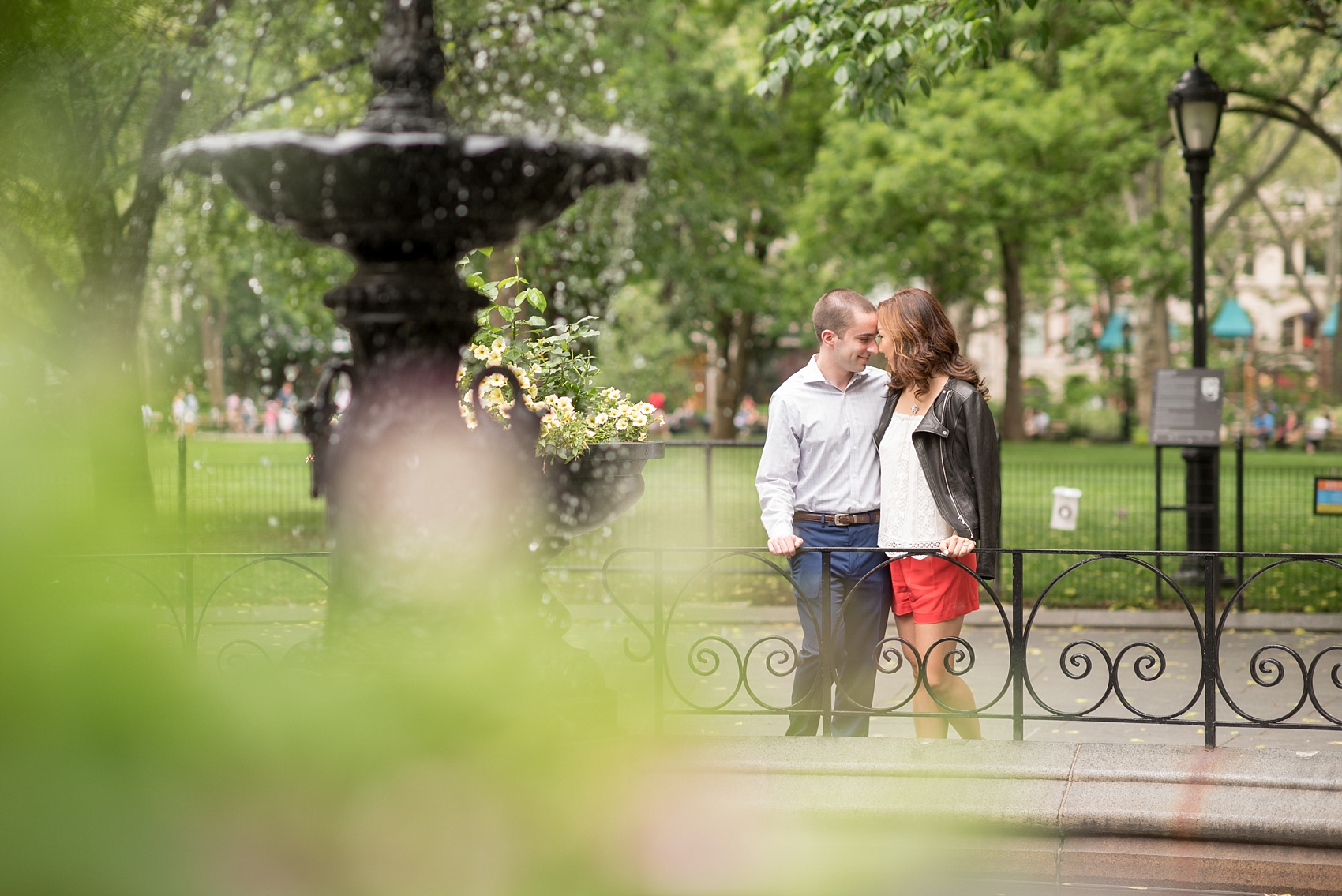 Mikkel Paige Photography photos of a Madison Square Park engagement session in NYC by the fountain. 