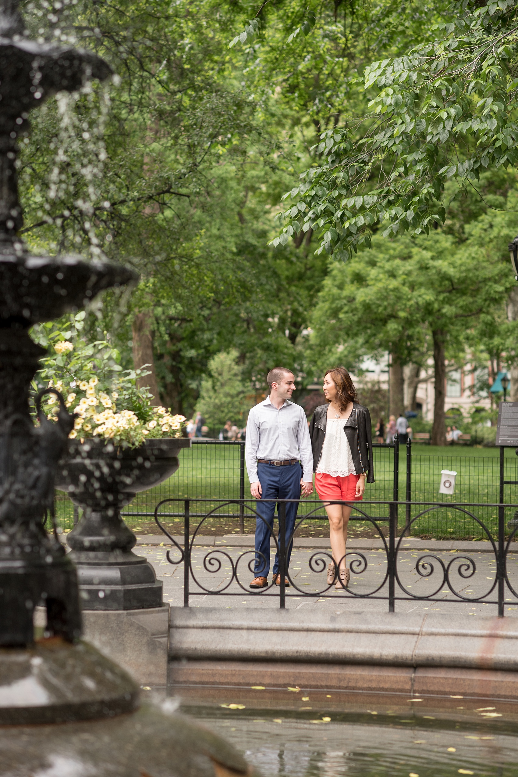 Mikkel Paige Photography photos of a Madison Square Park engagement session in NYC by the fountain. 