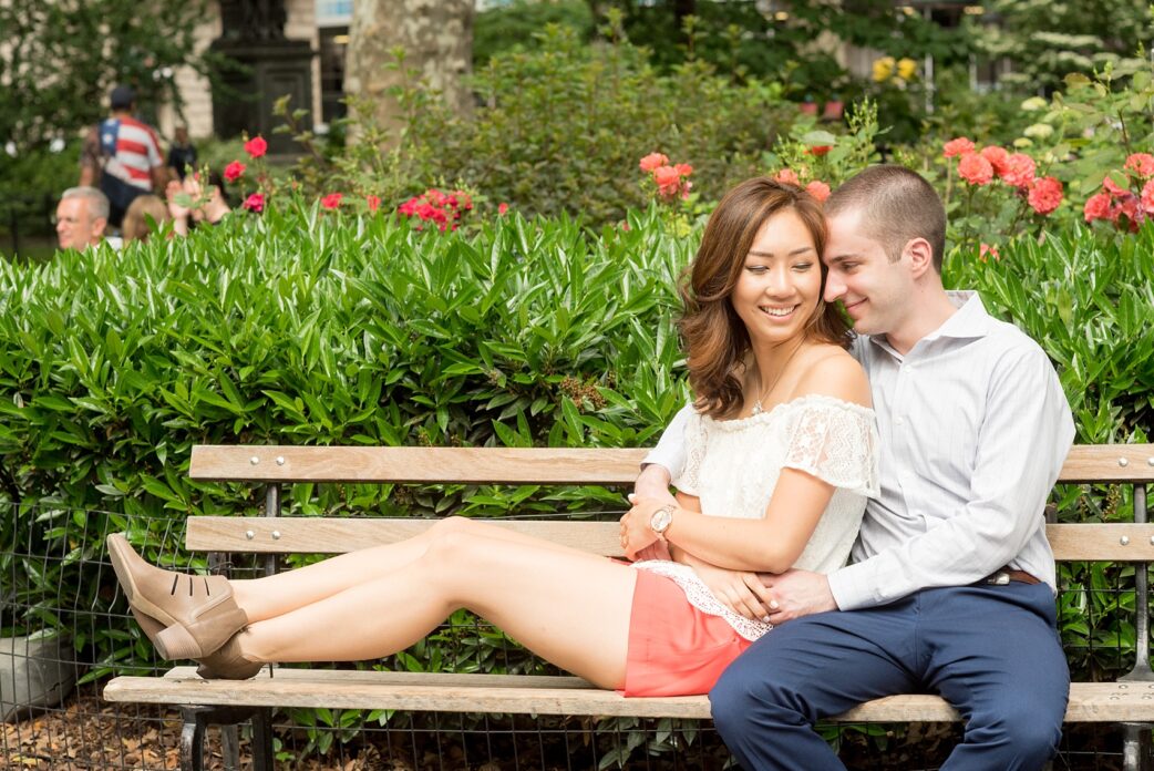 Mikkel Paige Photography photos of a Madison Square Park engagement session in NYC during spring. The bride wore an off-the-shoulder white lace top and orange shorts.