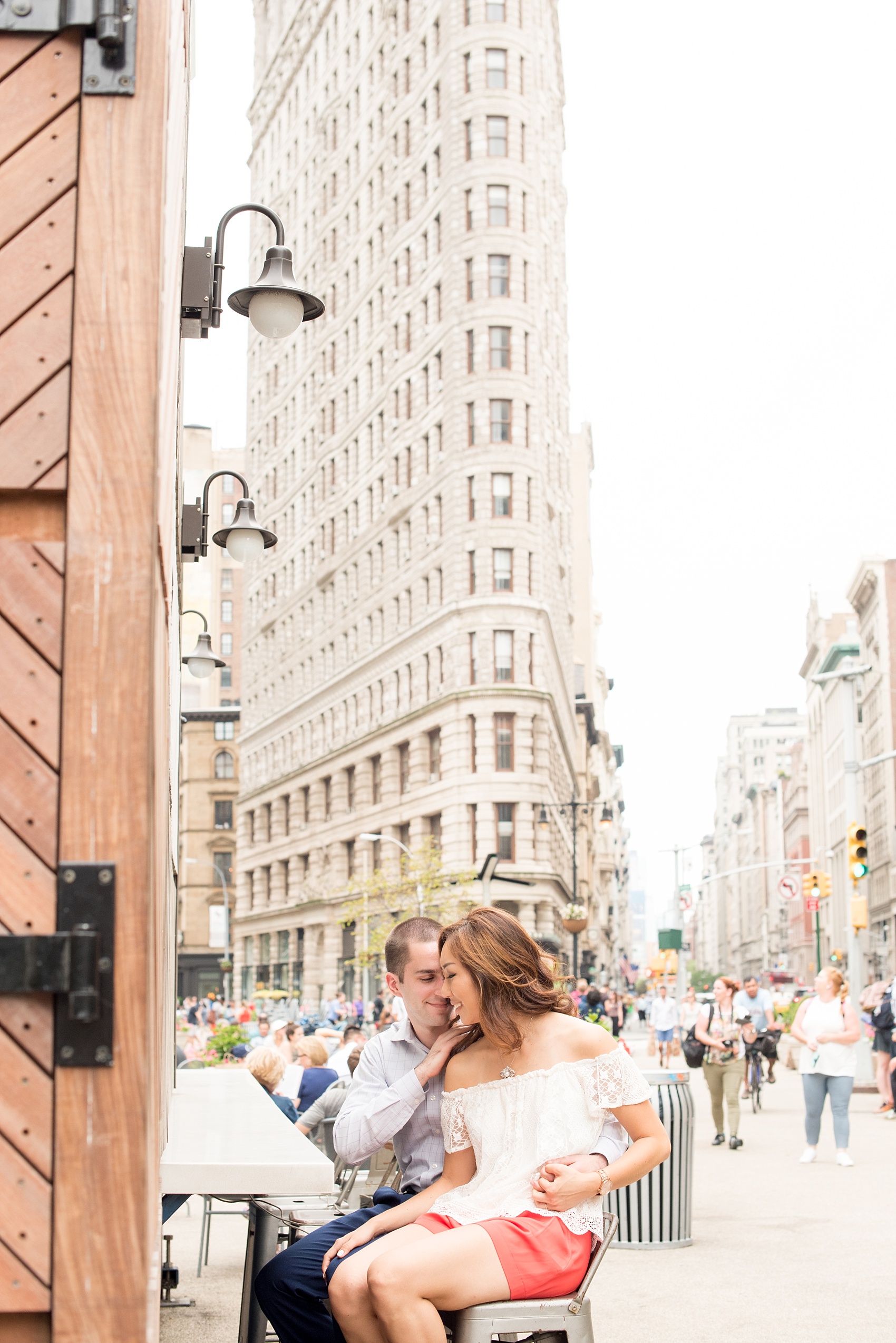 Mikkel Paige Photography photos of a Madison Square Park engagement session in NYC by the Flatiron building.