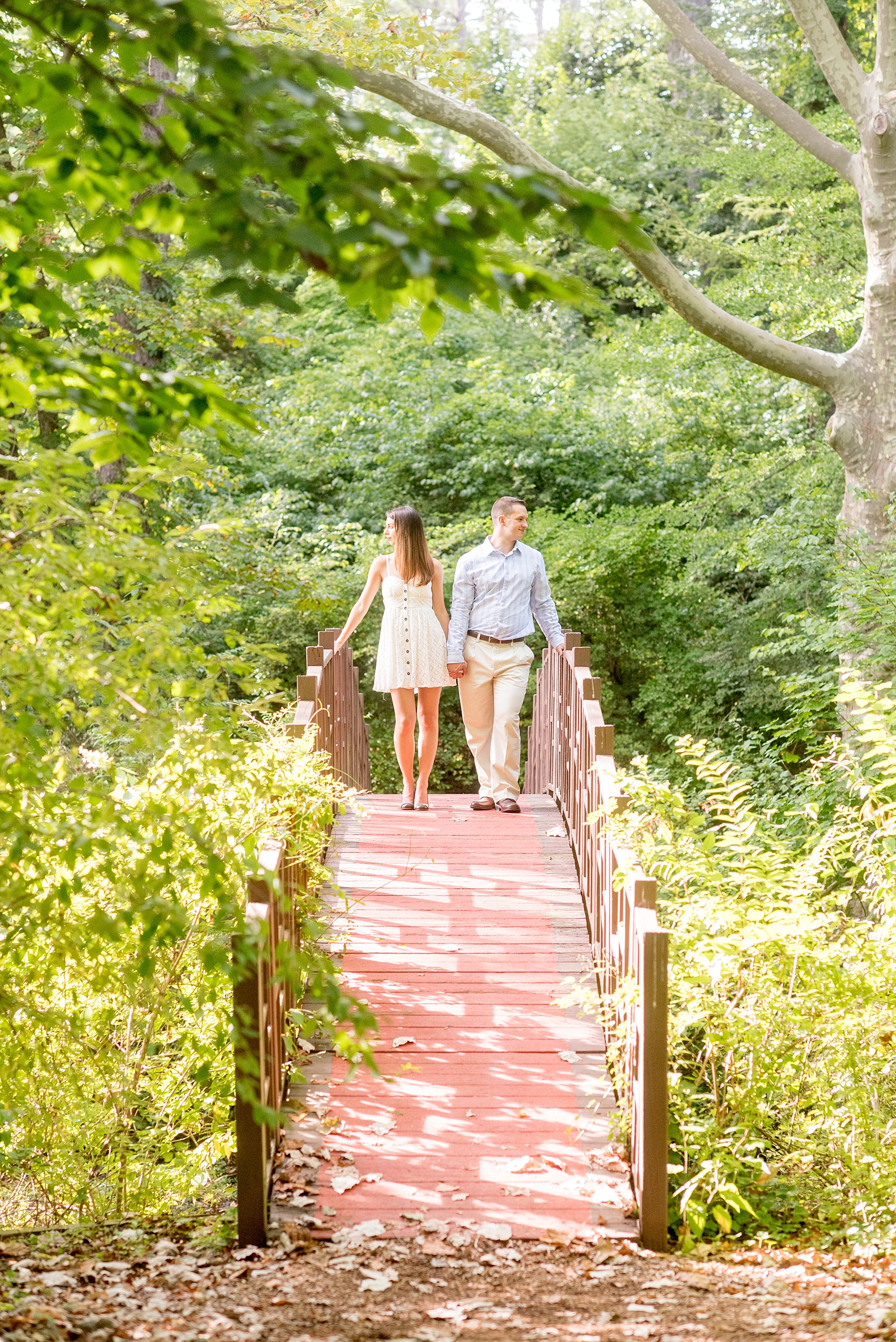 Mikkel Paige Photography bridge photo at an Old Westbury Gardens engagement session on Long Island.