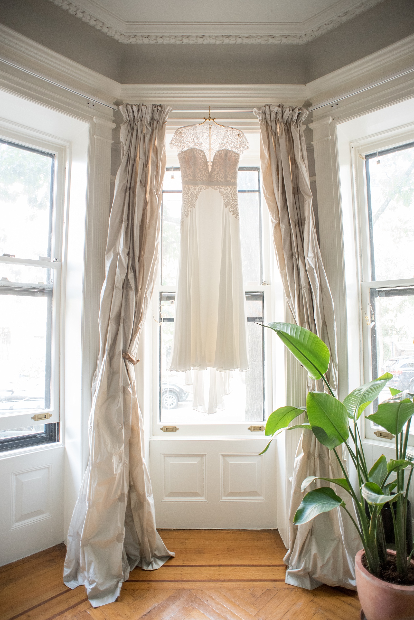 Mikkel Paige Photography photos of a wedding at Prospect Park Boathouse in Brooklyn, NY. A lace Reem Acra gown for the bride.