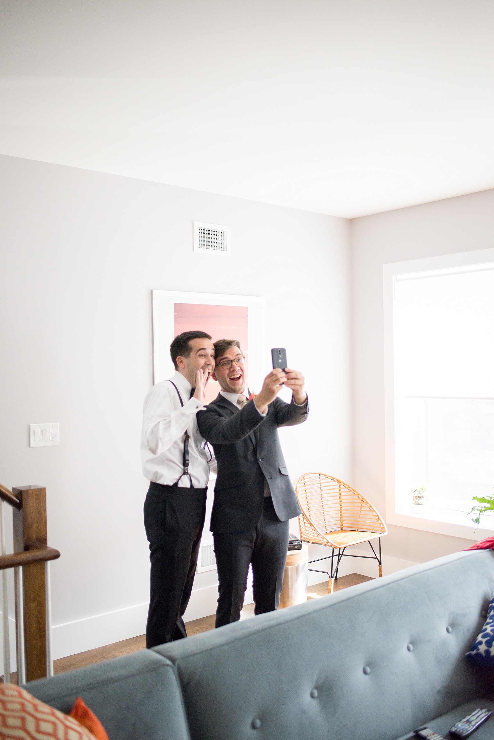 Mikkel Paige Photography photos of a wedding at Prospect Park Boathouse in Brooklyn, NY. A photo of the groom preparing for his day in a mod Air BnB in NYC.