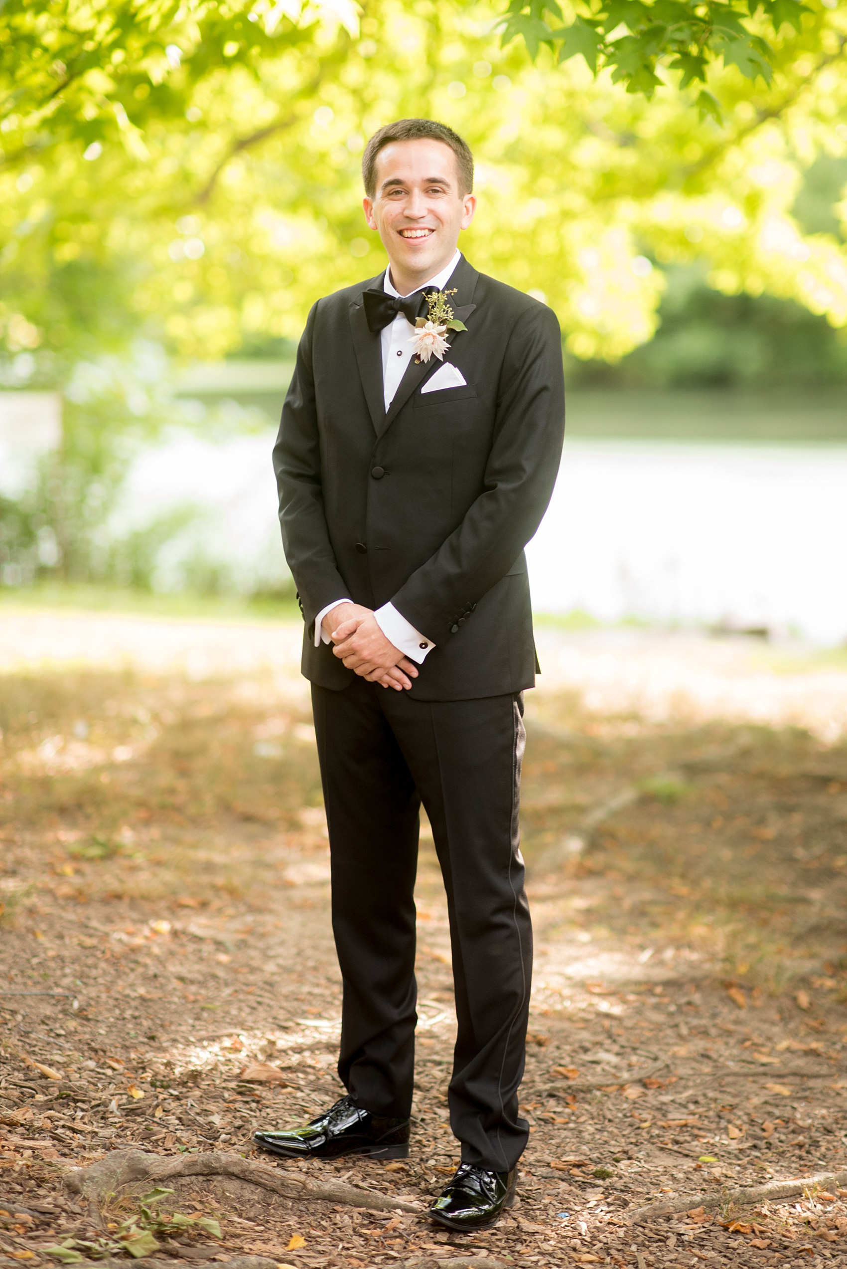 Mikkel Paige Photography photos of a wedding at Prospect Park Boathouse in Brooklyn, NY. The groom wore a classic black tuxedo and bow tie.