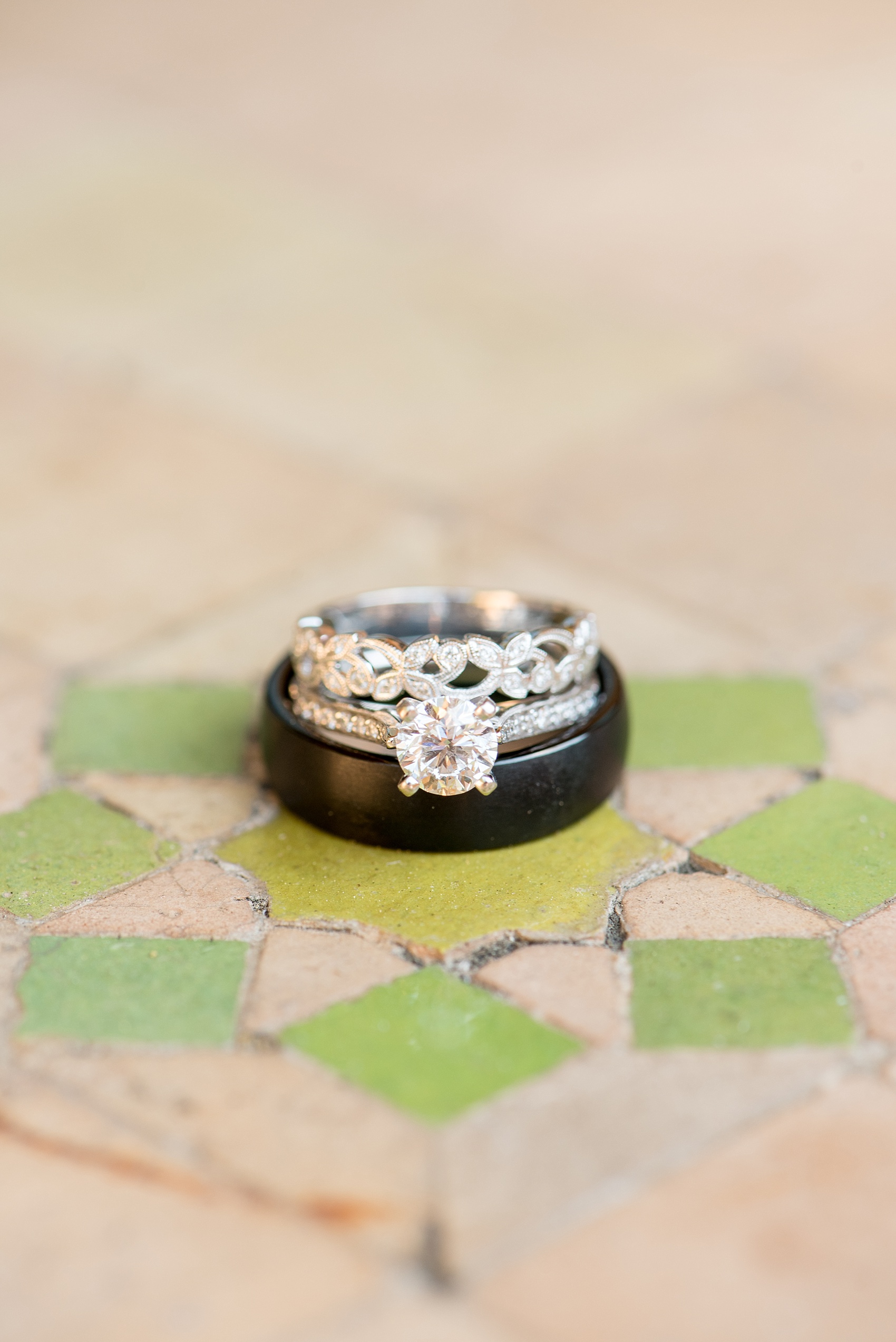 Mikkel Paige Photography photo of diamond rings and a black wedding band at Hotel Los Gatos California for a ceremony at Testarossa Winery.