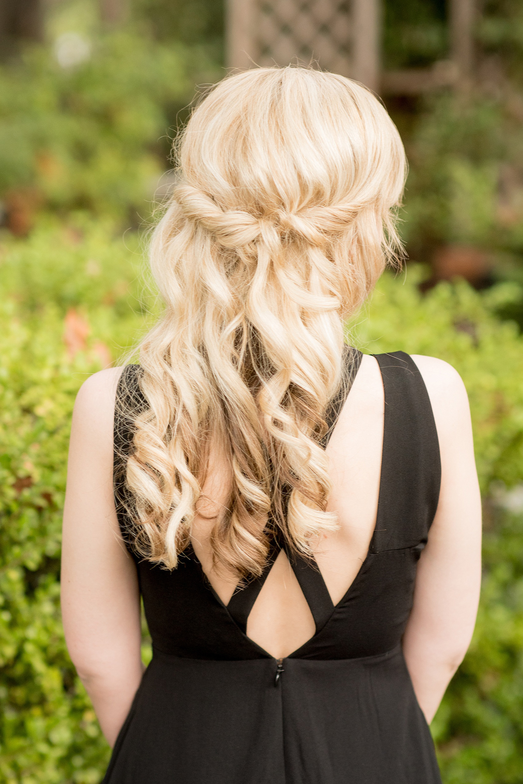 Mikkel Paige Photography photo of a bridesmaid's half up hair do by Charismatic Bride at a wedding at Testarossa Winery in Los Gatos, California.