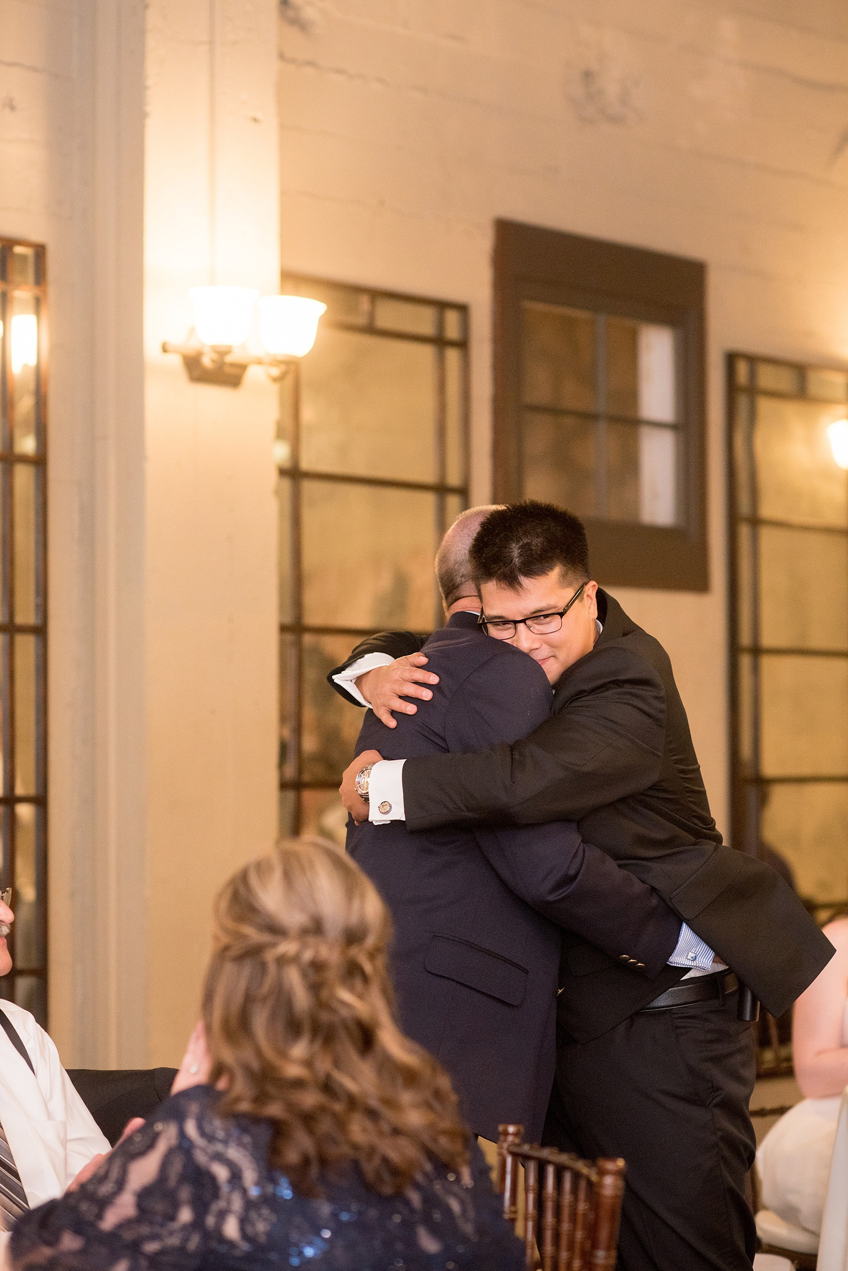 Mikkel Paige Photography reception photo of the groom and his father at a Testarossa Winery wedding in Los Gatos, California.