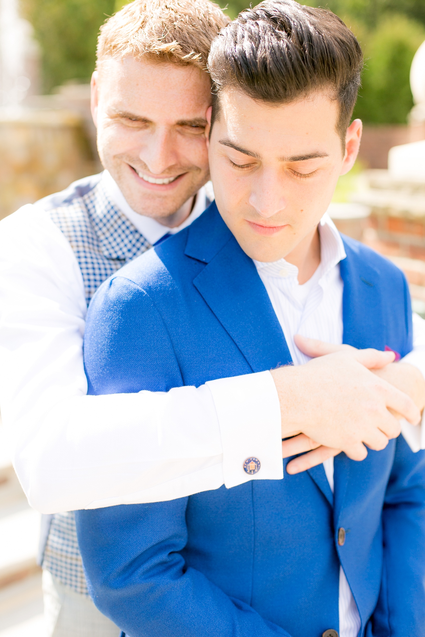 Mikkel Paige Photography photos of a gay wedding at The Manor in West Orange, NJ. The grooms wore a plaid vest and blue suit.