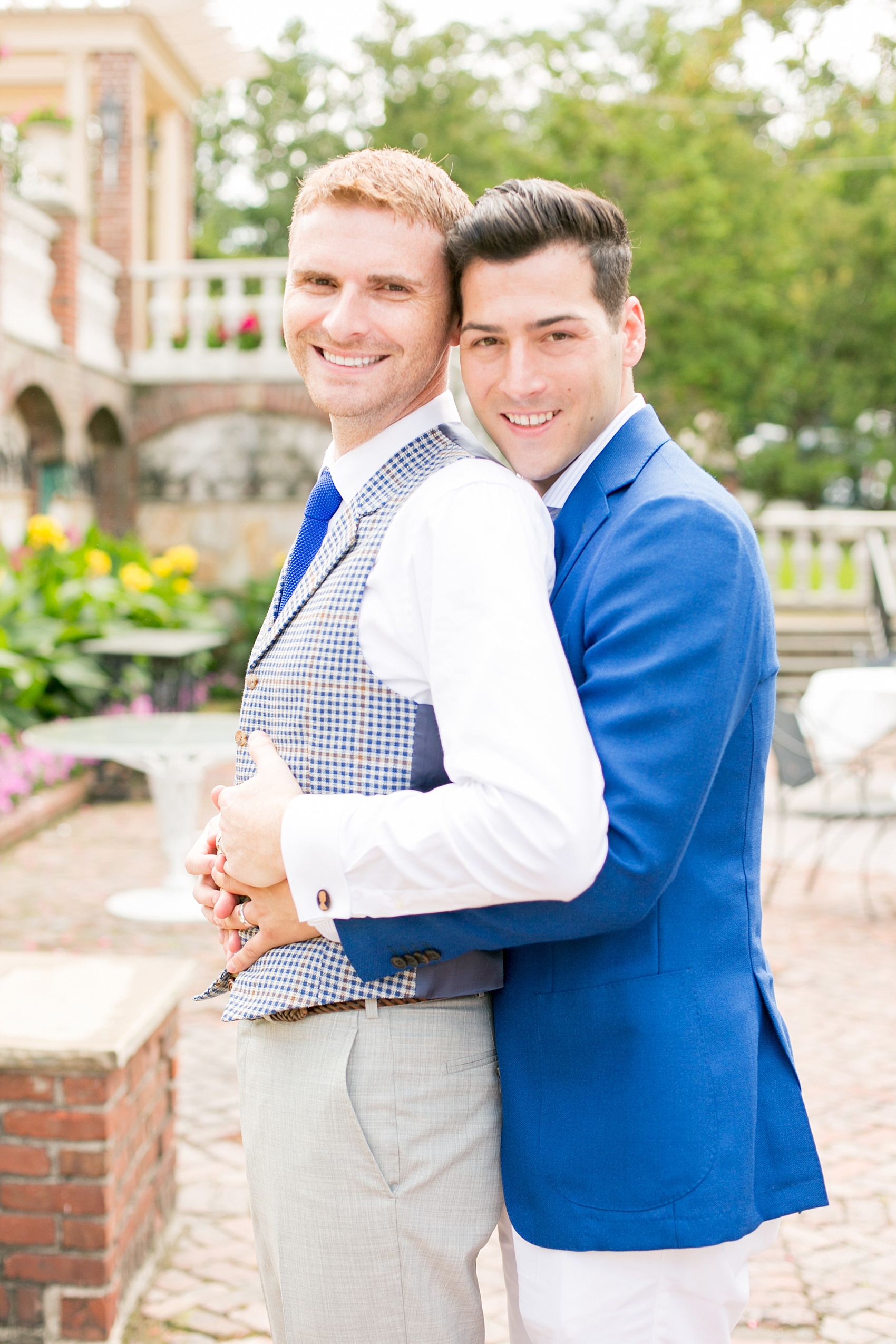 Mikkel Paige Photography photos of a gay wedding at The Manor in West Orange, NJ. The grooms wore a plaid vest and blue suit.