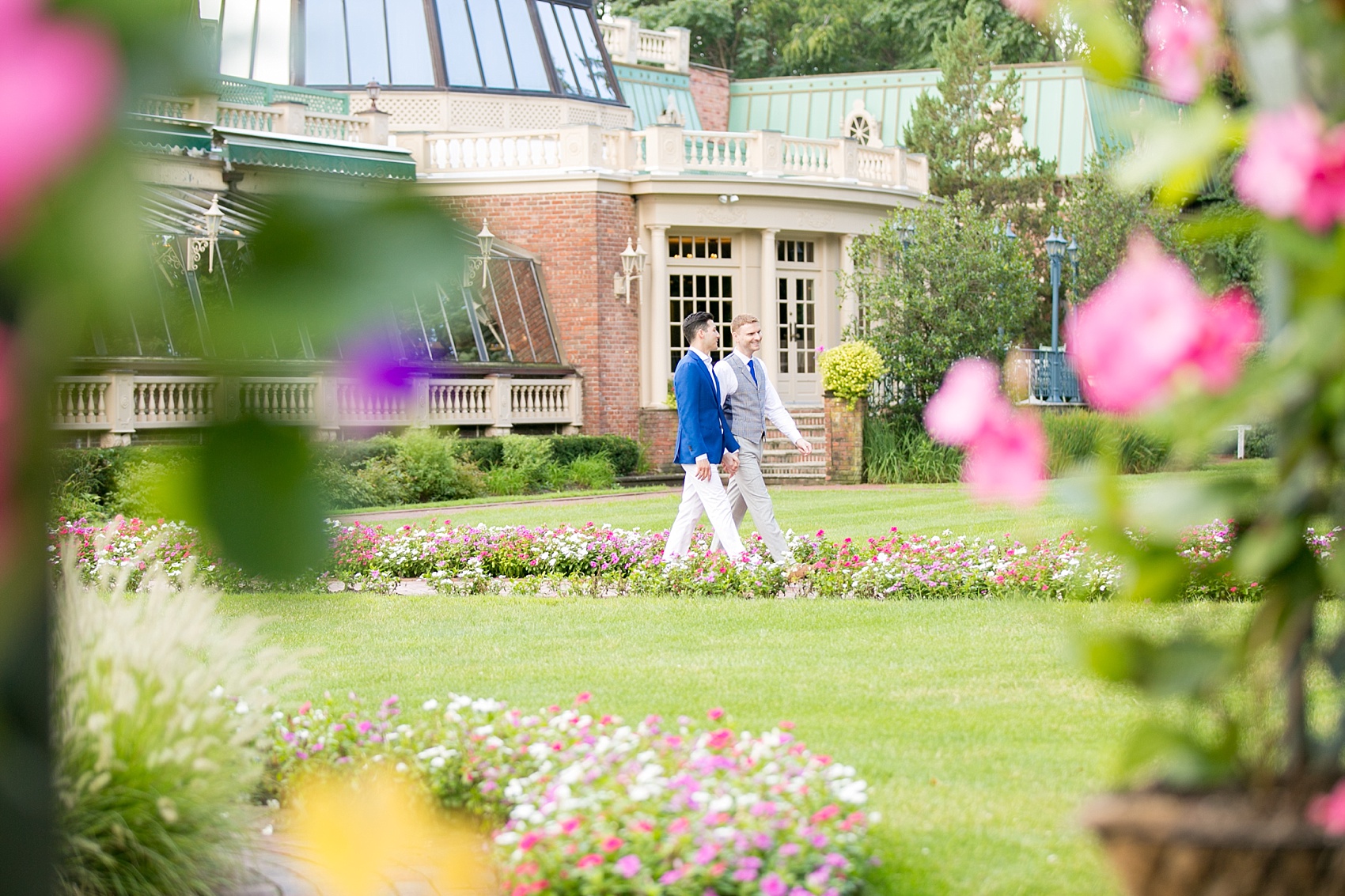 Mikkel Paige Photography photos of a gay wedding at The Manor in West Orange, NJ. The grooms walk to their outdoor summer ceremony.