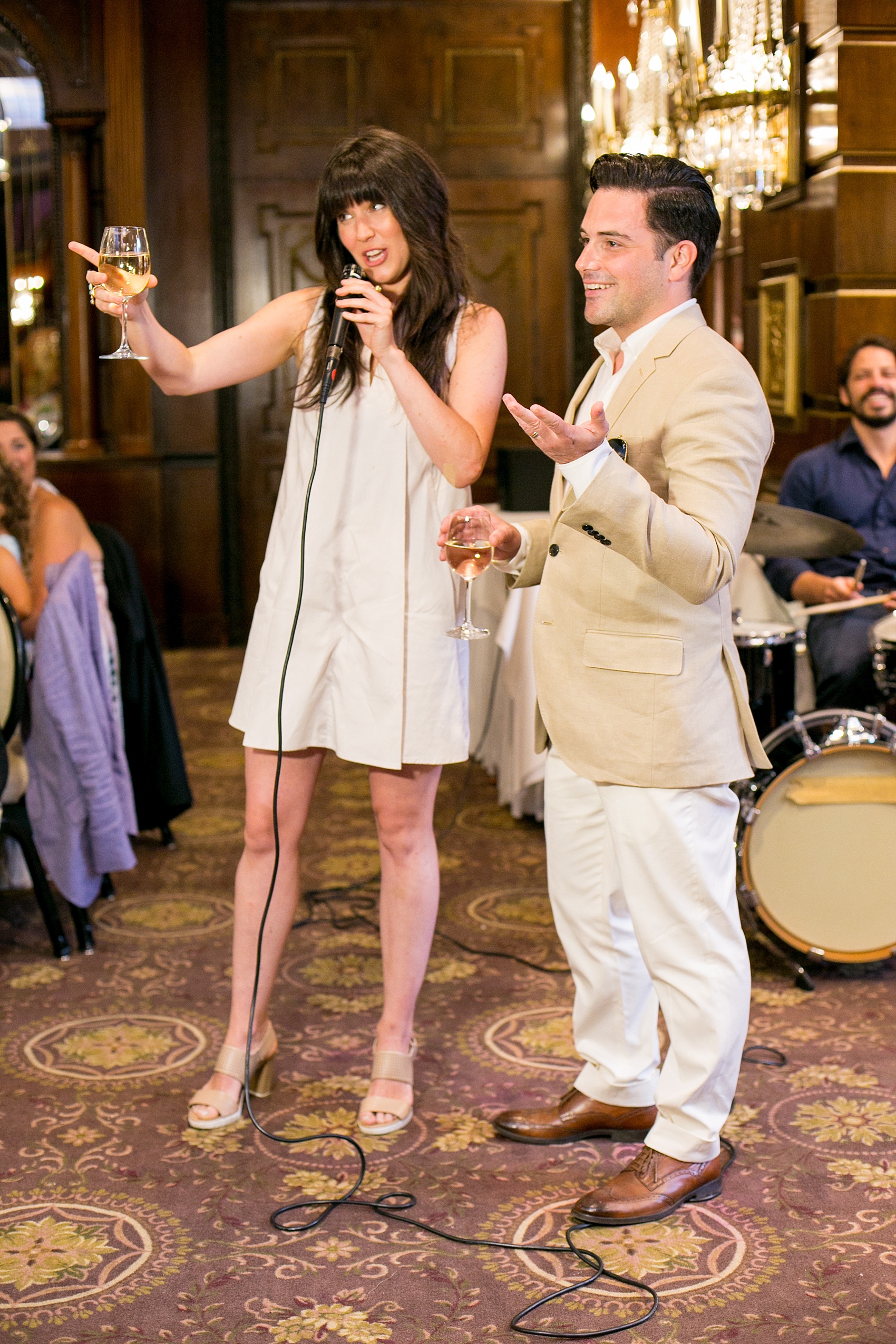 Mikkel Paige Photography photos of a gay wedding at The Manor in West Orange, NJ. Daytime reception with the grooms looking on as a special toast is given.