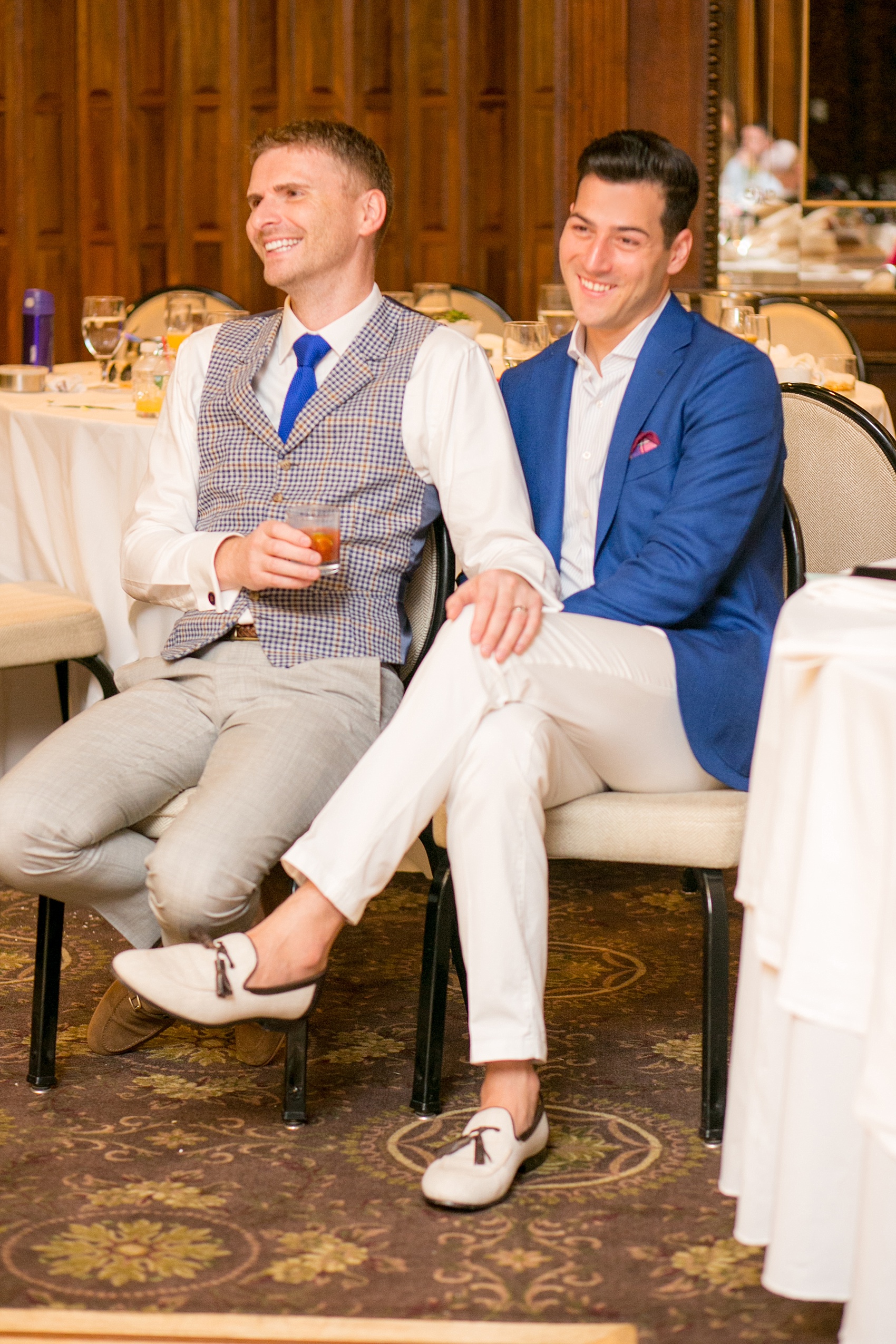 Mikkel Paige Photography photos of a gay wedding at The Manor in West Orange, NJ. Daytime reception with the grooms looking on as a special toast is given.