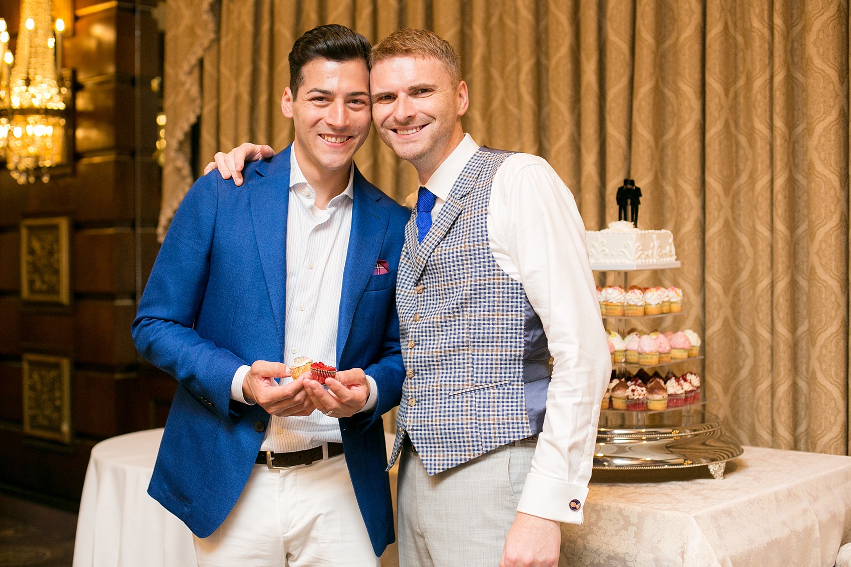 Mikkel Paige Photography photos of a gay wedding at The Manor in West Orange, NJ. The grooms chose a cupcake tower for a cake cutting.