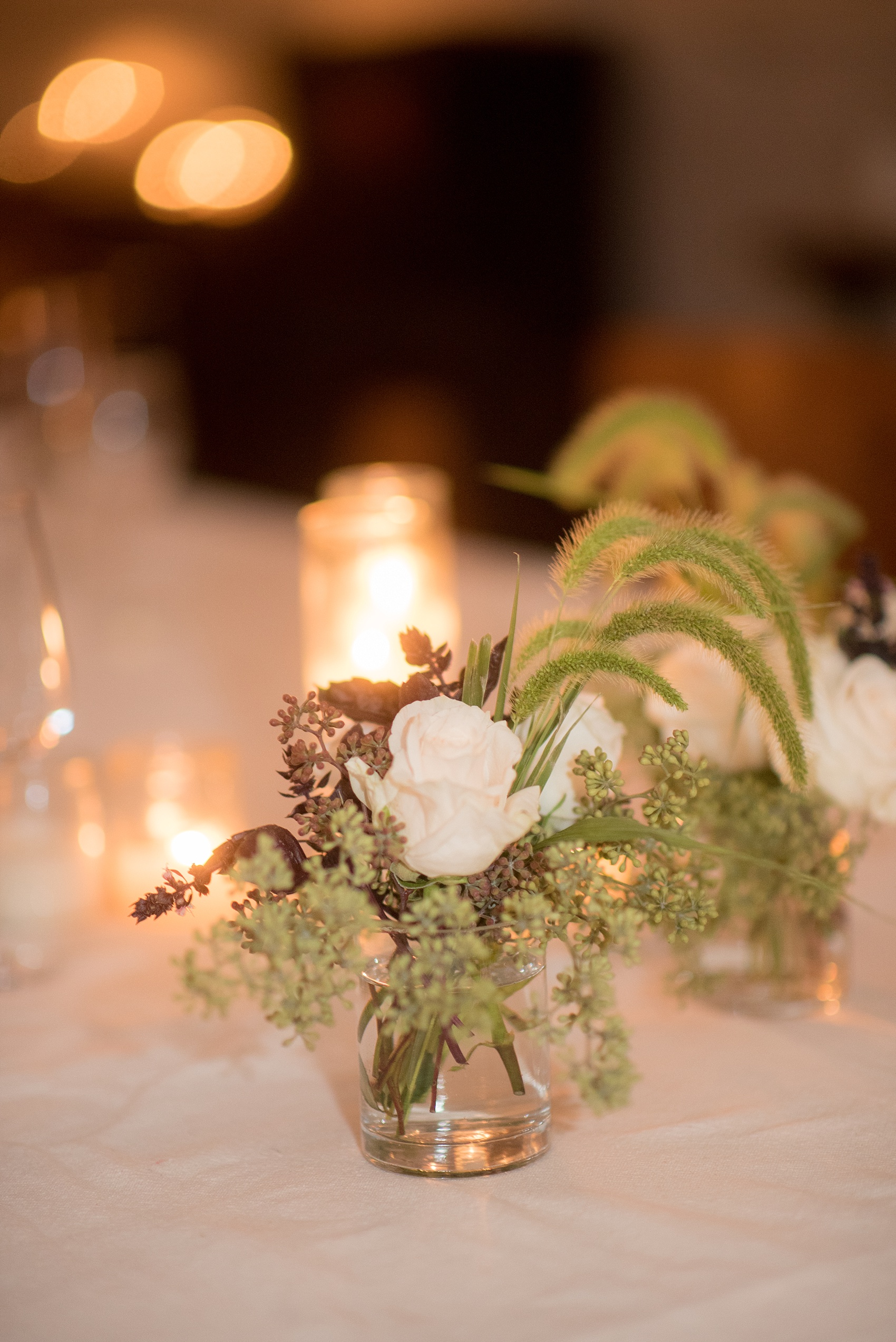 Mikkel Paige Photography photos of a wedding rehearsal dinner at Aterlier Roquette, Brooklyn. A romantic intimate setting for a small gathering complete with candlelight and small floral centerpieces.