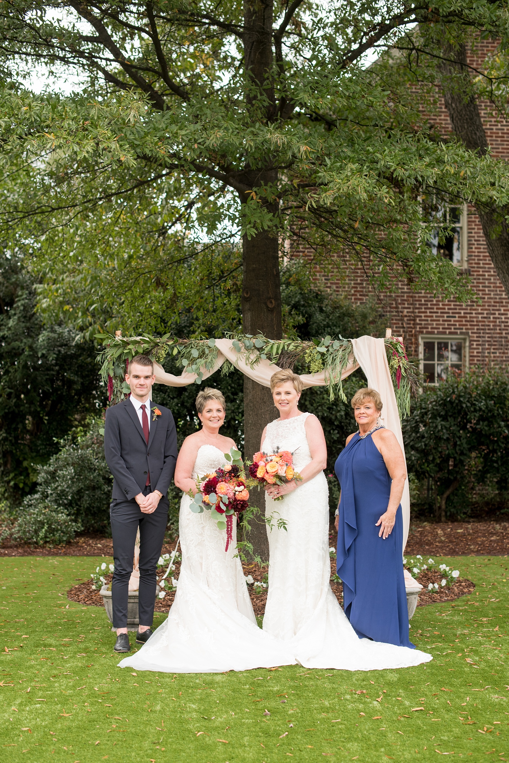 Mikkel Paige Photography photos from a Merrimon-Wynne House wedding in Raleigh. Two brides tie the knot during their same-sex fall wedding with their two best friends by their side.