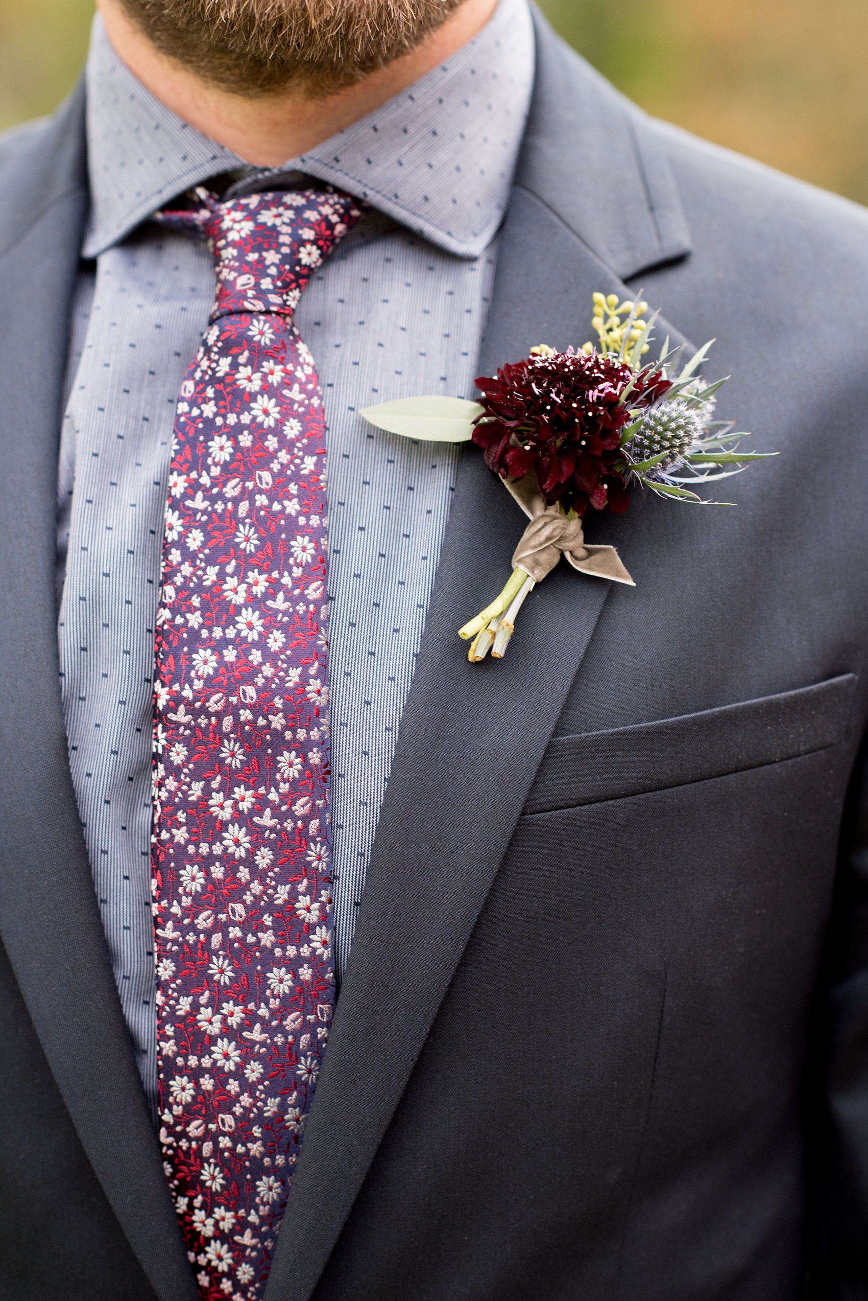 Mikkel Paige Photography photos from a Merrimon-Wynne House wedding in Raleigh. A deep purple fall boutonniere by Meristem Floral for a groomsman.