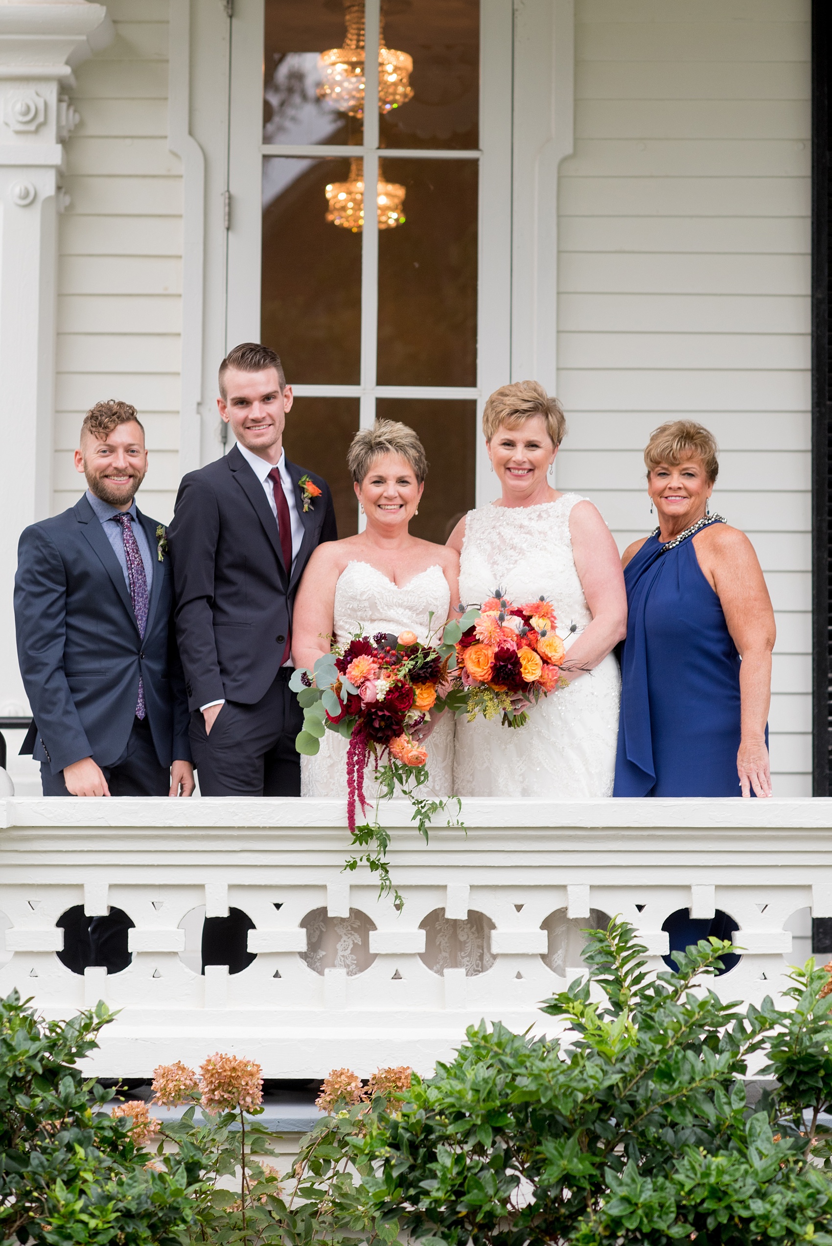 Mikkel Paige Photography photos from a Merrimon-Wynne House wedding in Raleigh. Two brides tie the knot during their same-sex fall wedding with their best friends by their side.