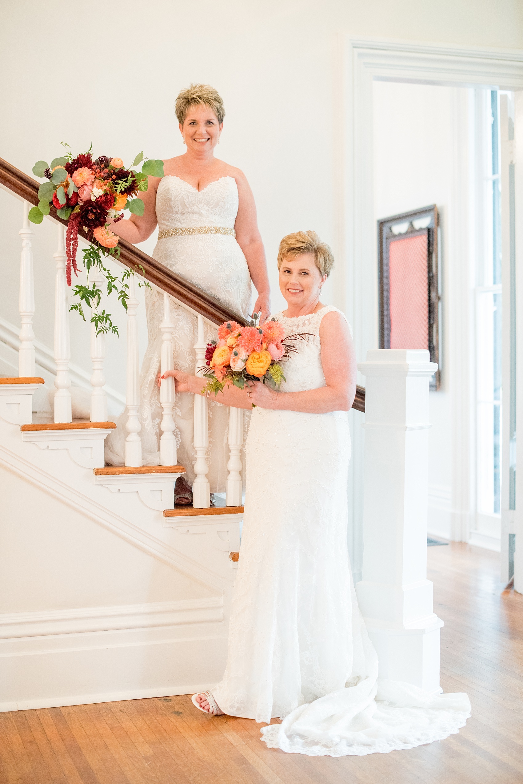 Mikkel Paige Photography photos from a Merrimon-Wynne House wedding in Raleigh. Two brides on a picturesque staircase for a same-sex, lesbian wedding.