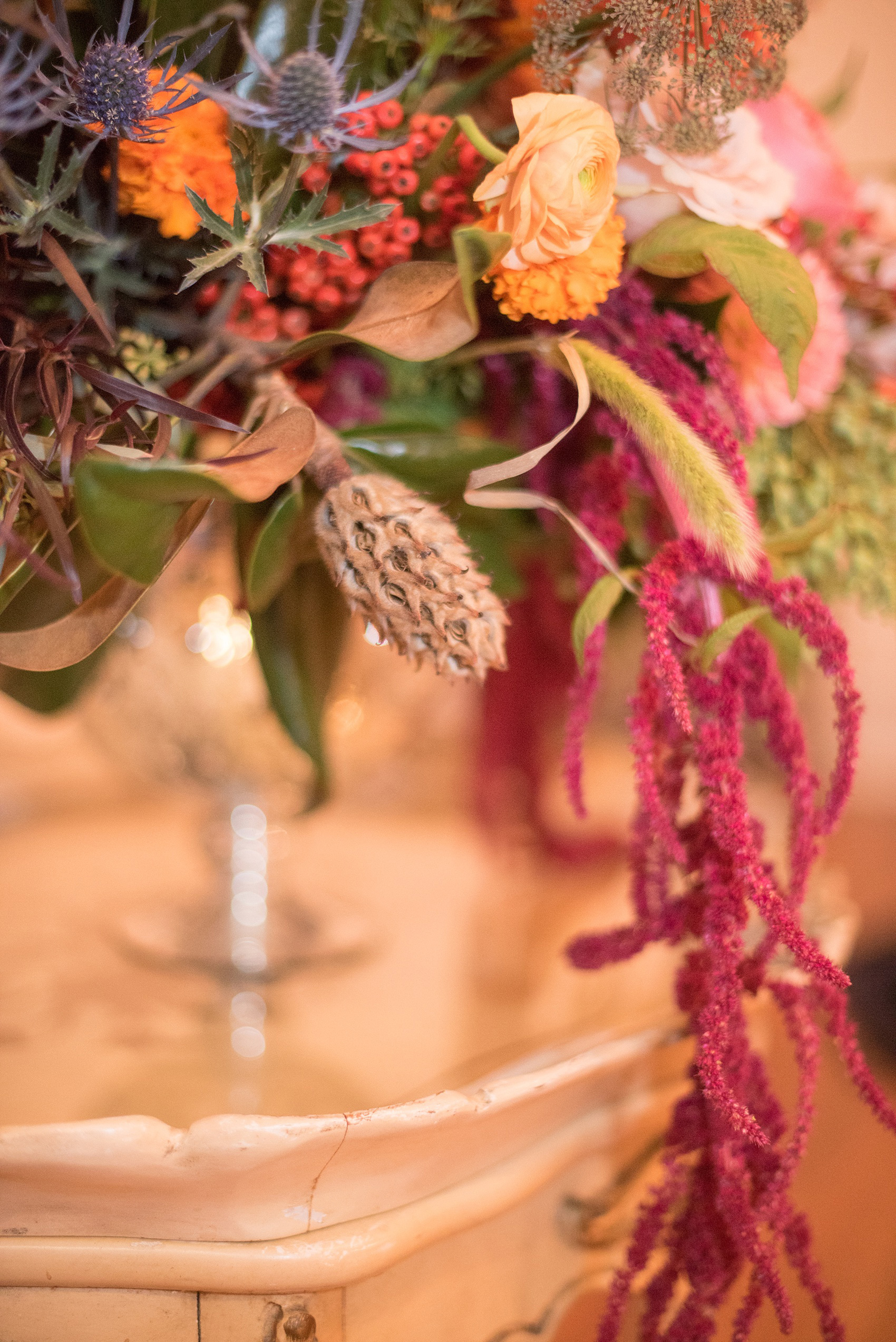 Mikkel Paige Photography photos from a Merrimon-Wynne House wedding in Raleigh. Meristem Floral created several fall colored centerpieces for a same-sex celebration.