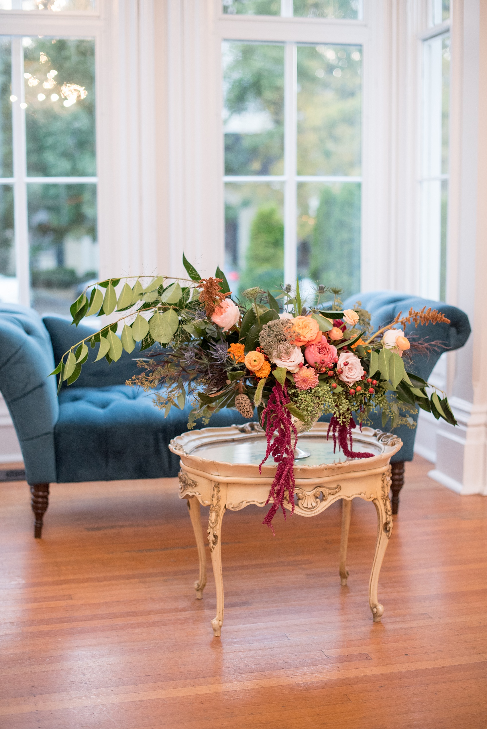 Mikkel Paige Photography photos from a Merrimon-Wynne House wedding in Raleigh. Meristem Floral created several fall colored centerpieces for a same-sex celebration.