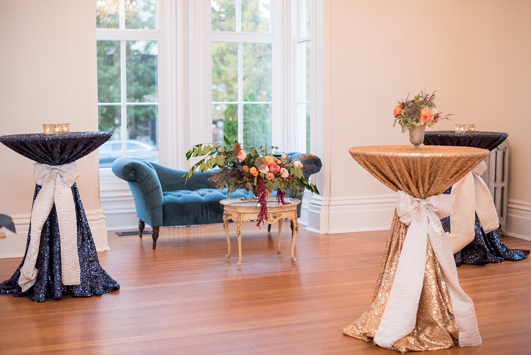 Mikkel Paige Photography photos from a Merrimon-Wynne House wedding in Raleigh. Cocktail hour was inside the southern mansion complete with gold sequin tablecloths and fall flowers.