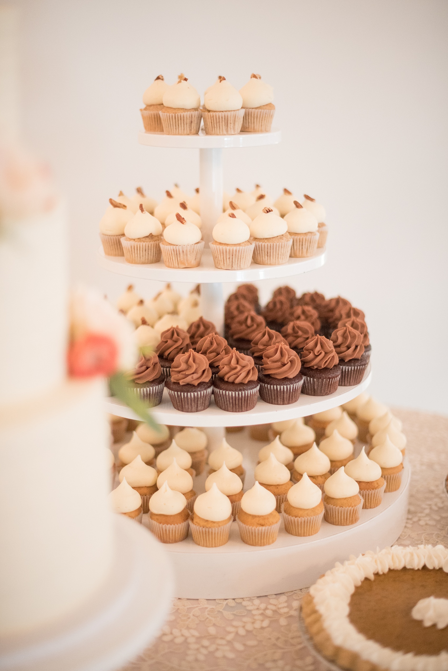 Mikkel Paige Photography photos from a Merrimon-Wynne House wedding in Raleigh. The Cupcake Shoppe created this mini-cupcake tower with chocolate, vanilla and pumpkin spice desserts.