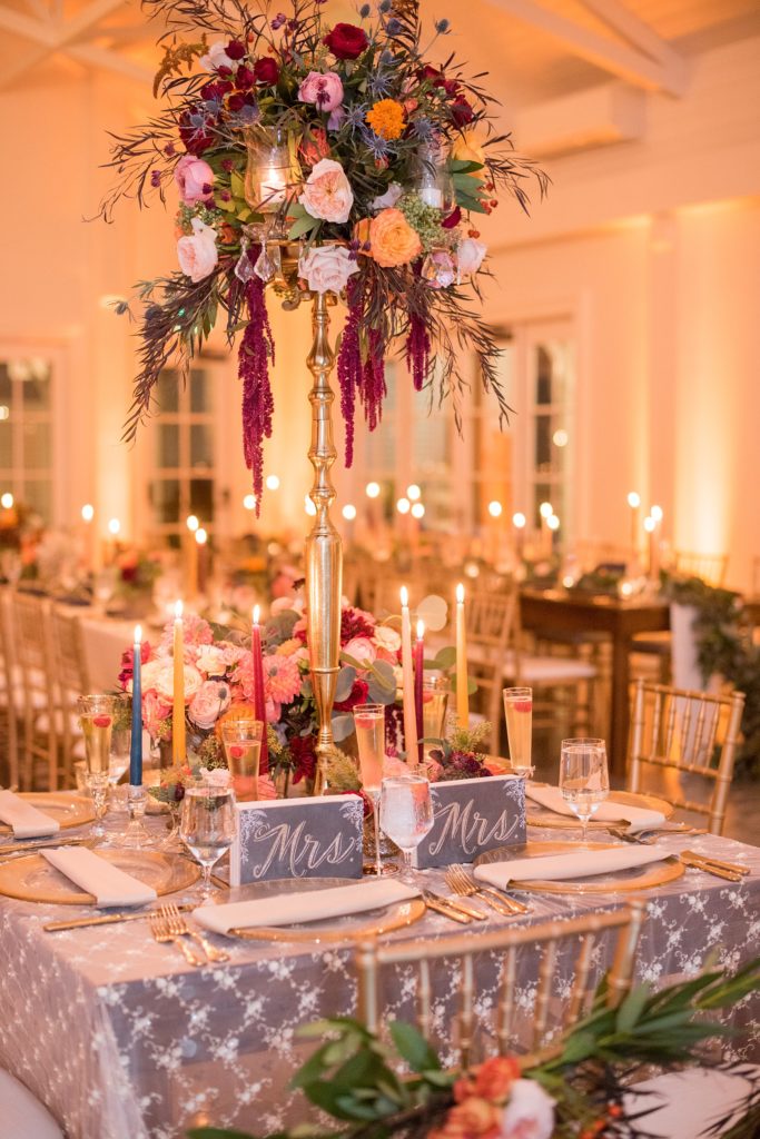 Mikkel Paige Photography photos from a Merrimon-Wynne House wedding in Raleigh. The reception was drenched in romantic candlelight and fall flowers held inside the Carriage House. 