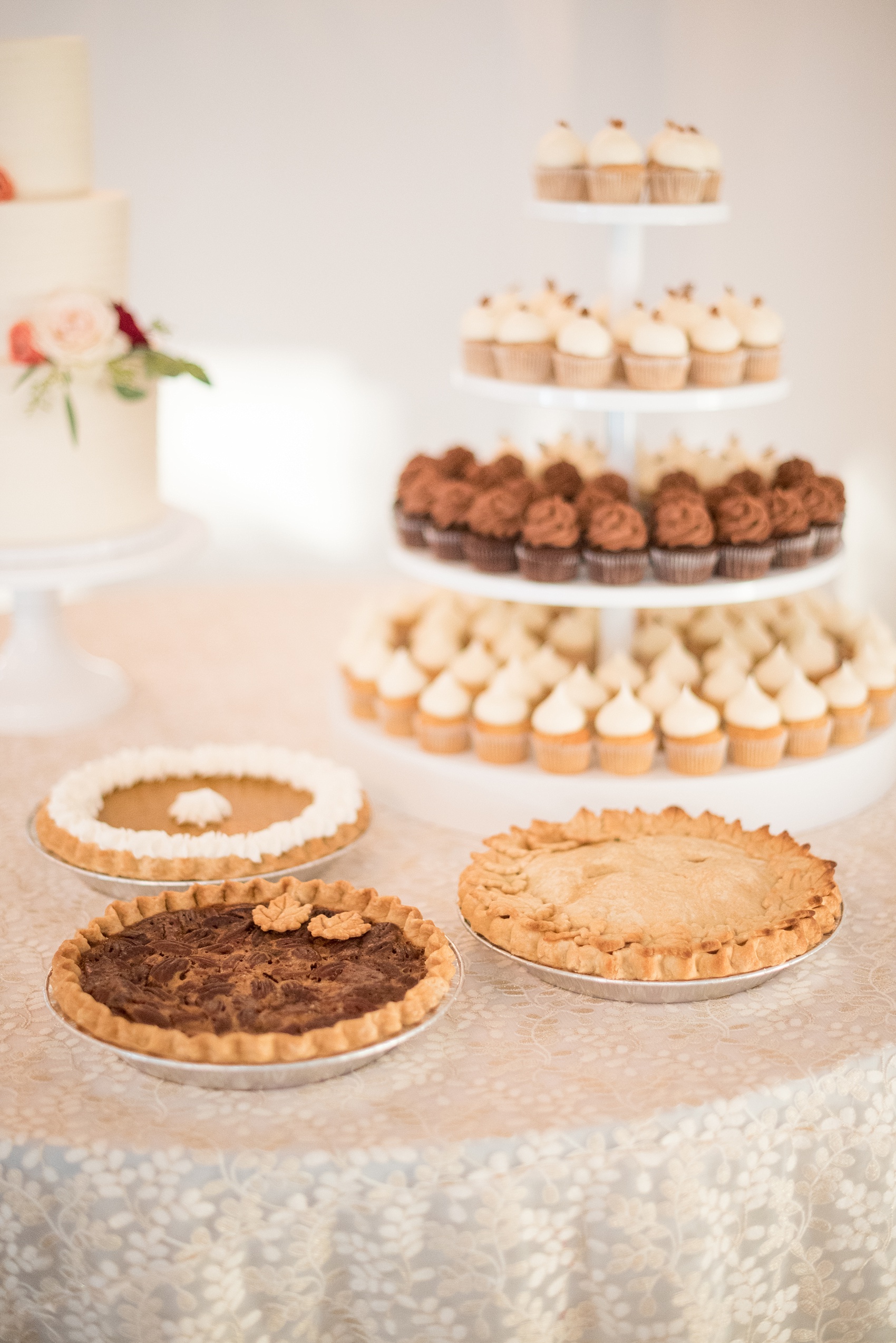 Mikkel Paige Photography photos from a Merrimon-Wynne House wedding in Raleigh. Slice Pie Company provided fall desserts and The Cupcake Shoppe created a tower with chocolate, vanilla and pumpkin spice mini-cupcakes.