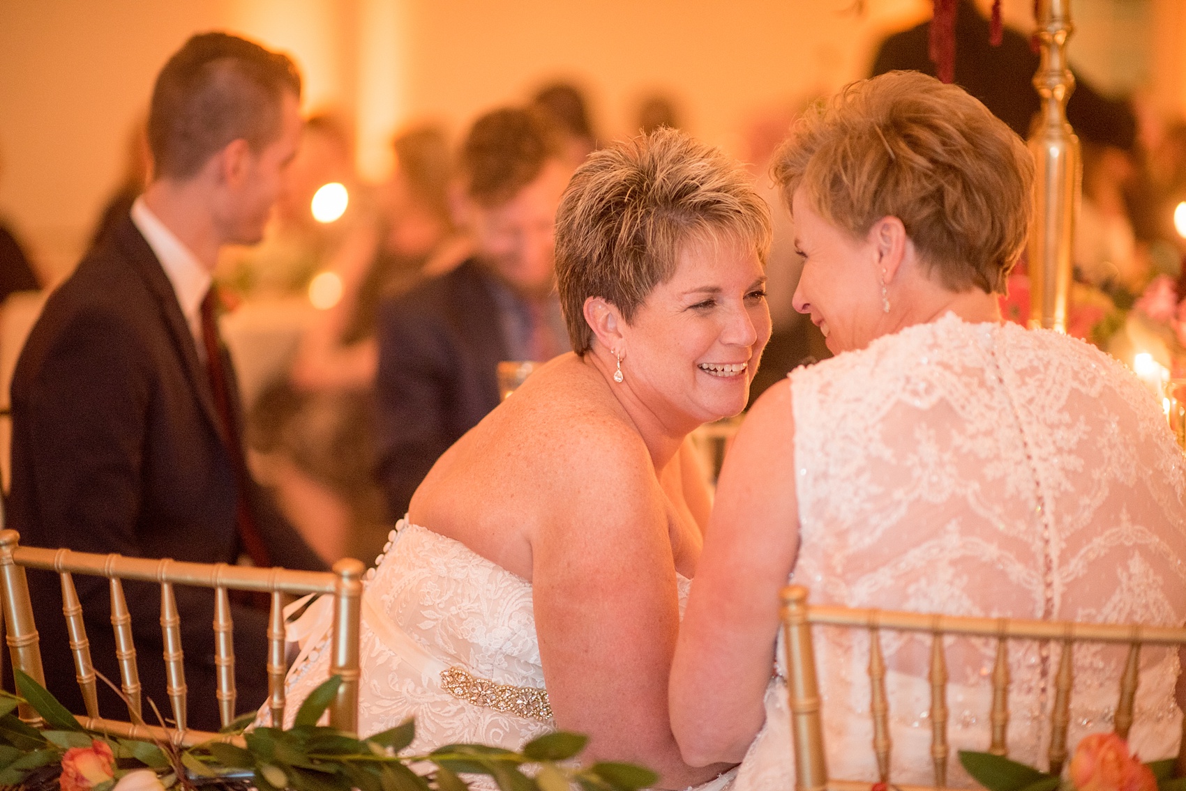 Mikkel Paige Photography photos from a Merrimon-Wynne House wedding in Raleigh. The brides enjoy their romantic candlelight reception inside the Carriage House.