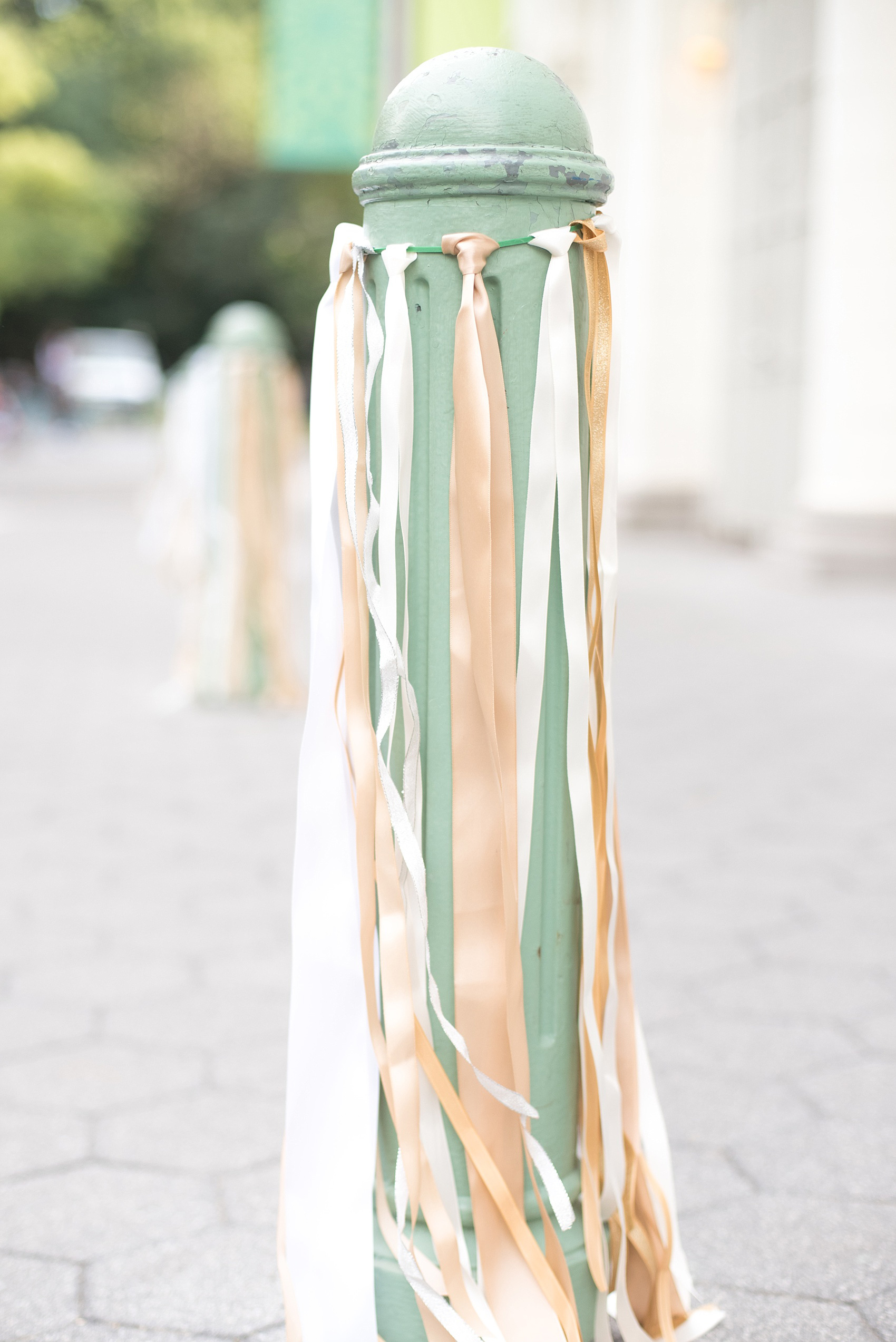 Mikkel Paige Photography photo of ribbons on a pylon for unique wedding details. The wedding was at Prospect Park Boathouse in Brooklyn, NYC.