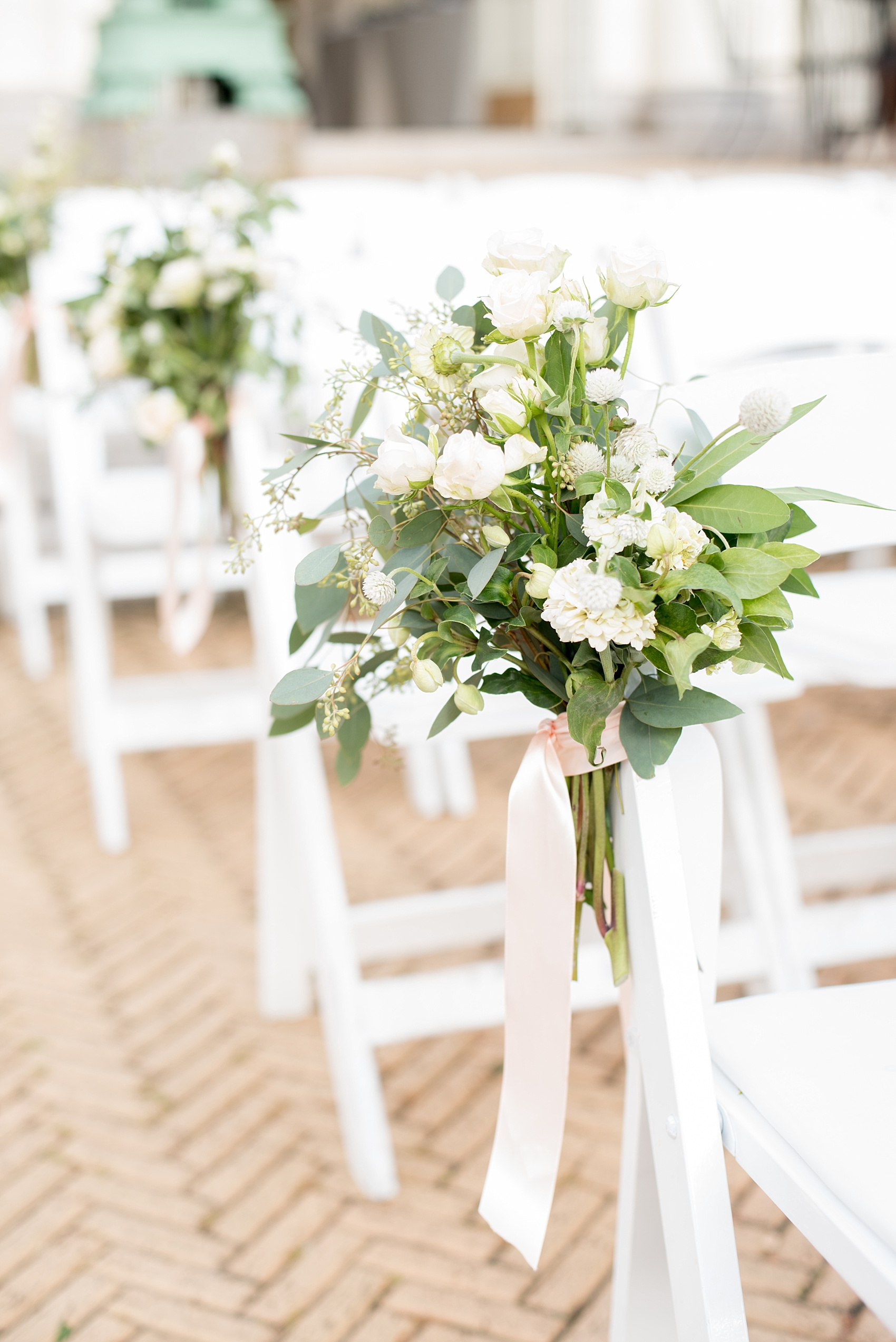 Mikkel Paige Photography photo of an outdoor ceremony floral piece at a Prospect Park Boathouse wedding.