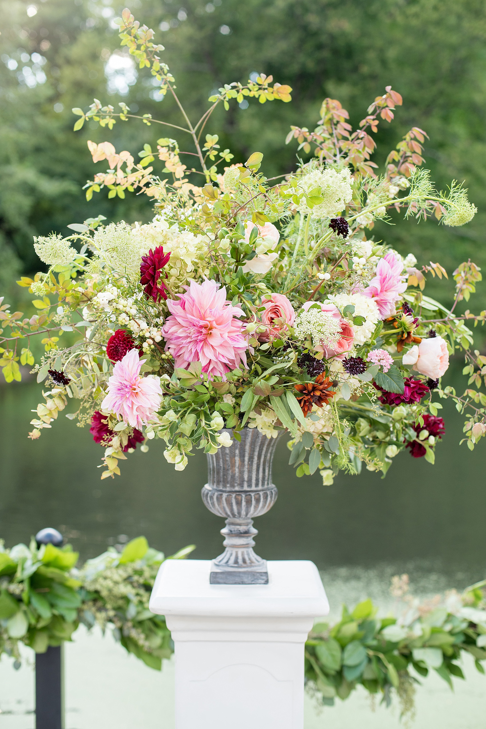 Mikkel Paige Photography photo of a statement altar floral piece at a Prospect Park Boathouse wedding, by Sachi Rose.