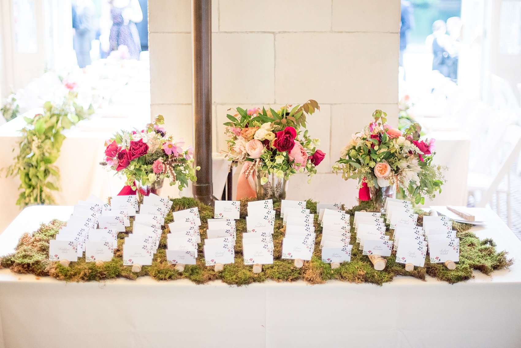 Mikkel Paige Photography photo of a woodsy escort card table at a Prospect Park Boathouse wedding.