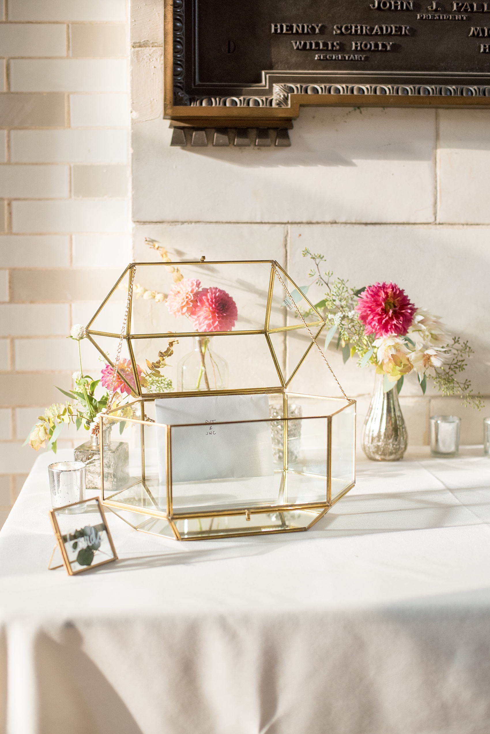 Mikkel Paige Photography photo of a card table with glass geometric holder at a Prospect Park Boathouse wedding in Brooklyn, NYC.