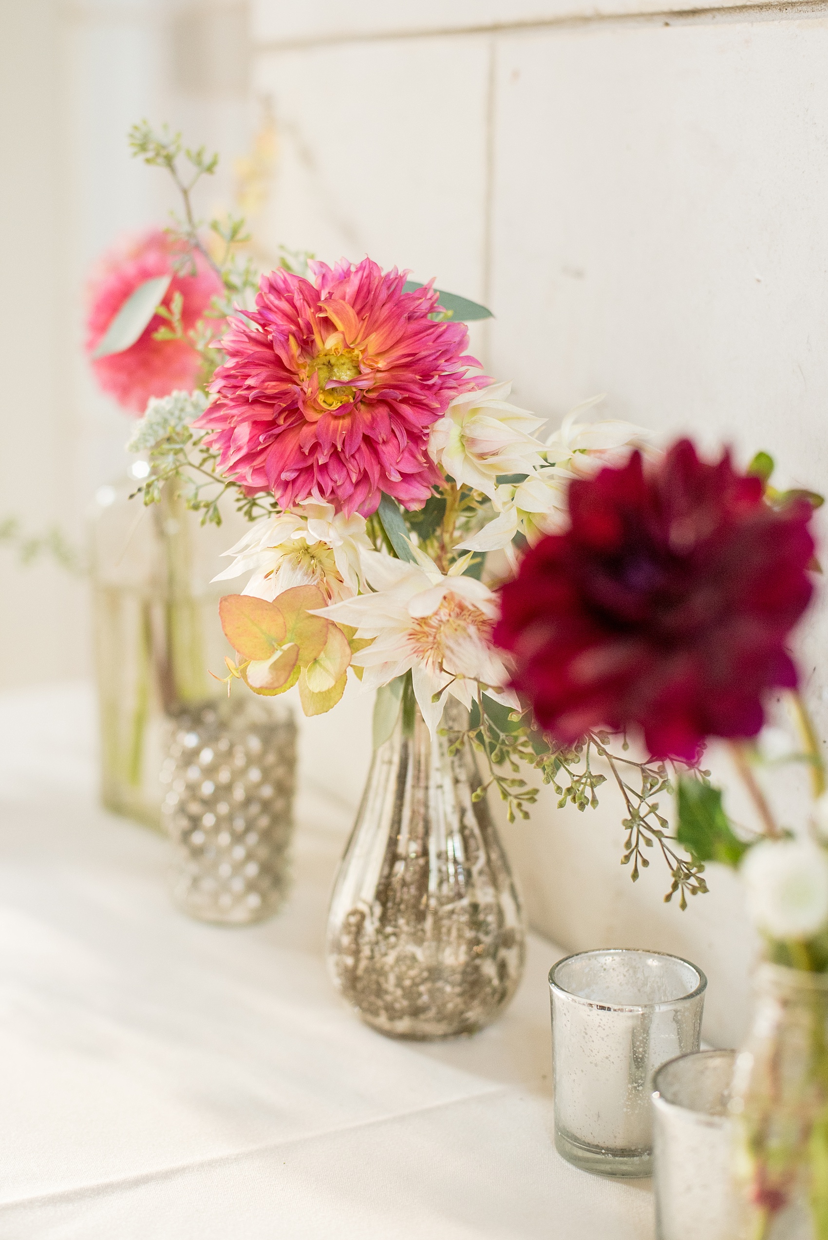 Mikkel Paige Photography photo of dahlia bud vases in mercury glass by Sachi Rose for a wedding at Brooklyn's Prospect Park Boathouse in NYC.