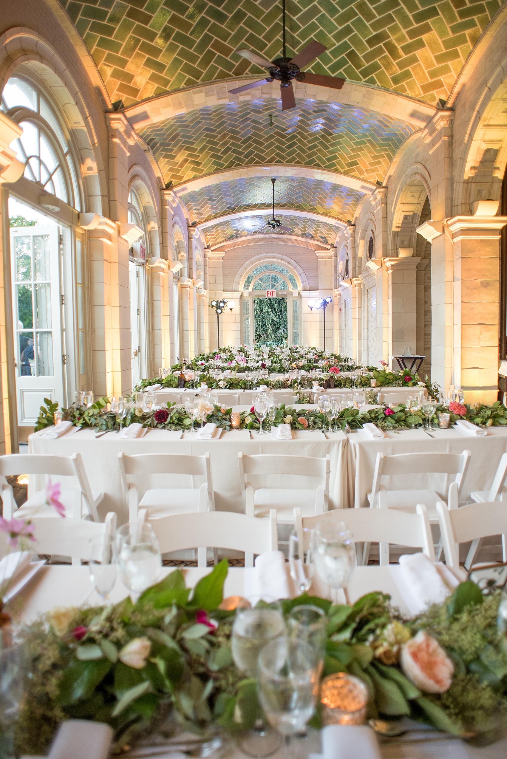 Mikkel Paige Photography photos of a wedding at Brooklyn's Prospect Park Boathouse with floral garland by Sachi Rose.