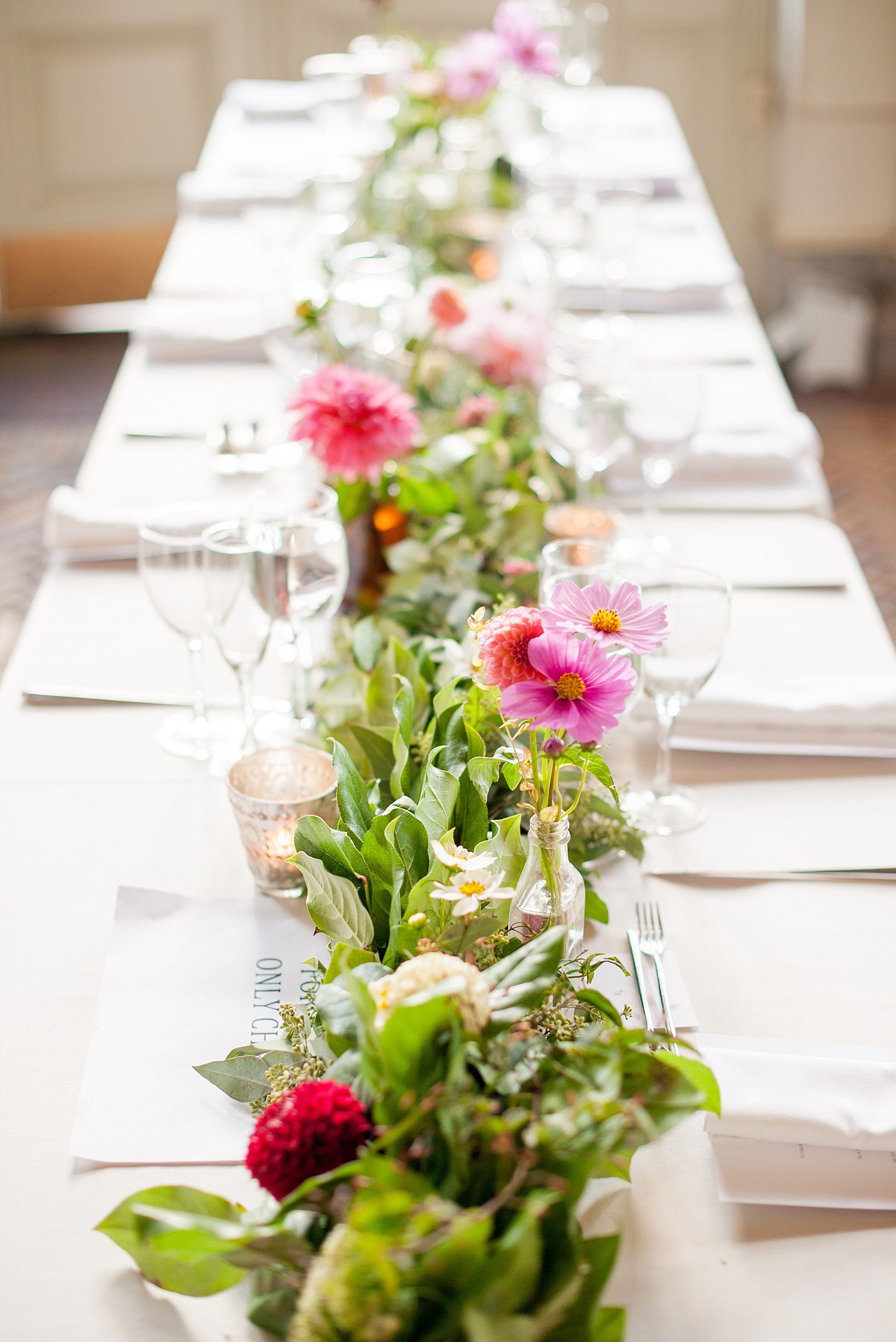 Mikkel Paige Photography photos of a wedding at Brooklyn's Prospect Park Boathouse with floral garland by Sachi Rose.