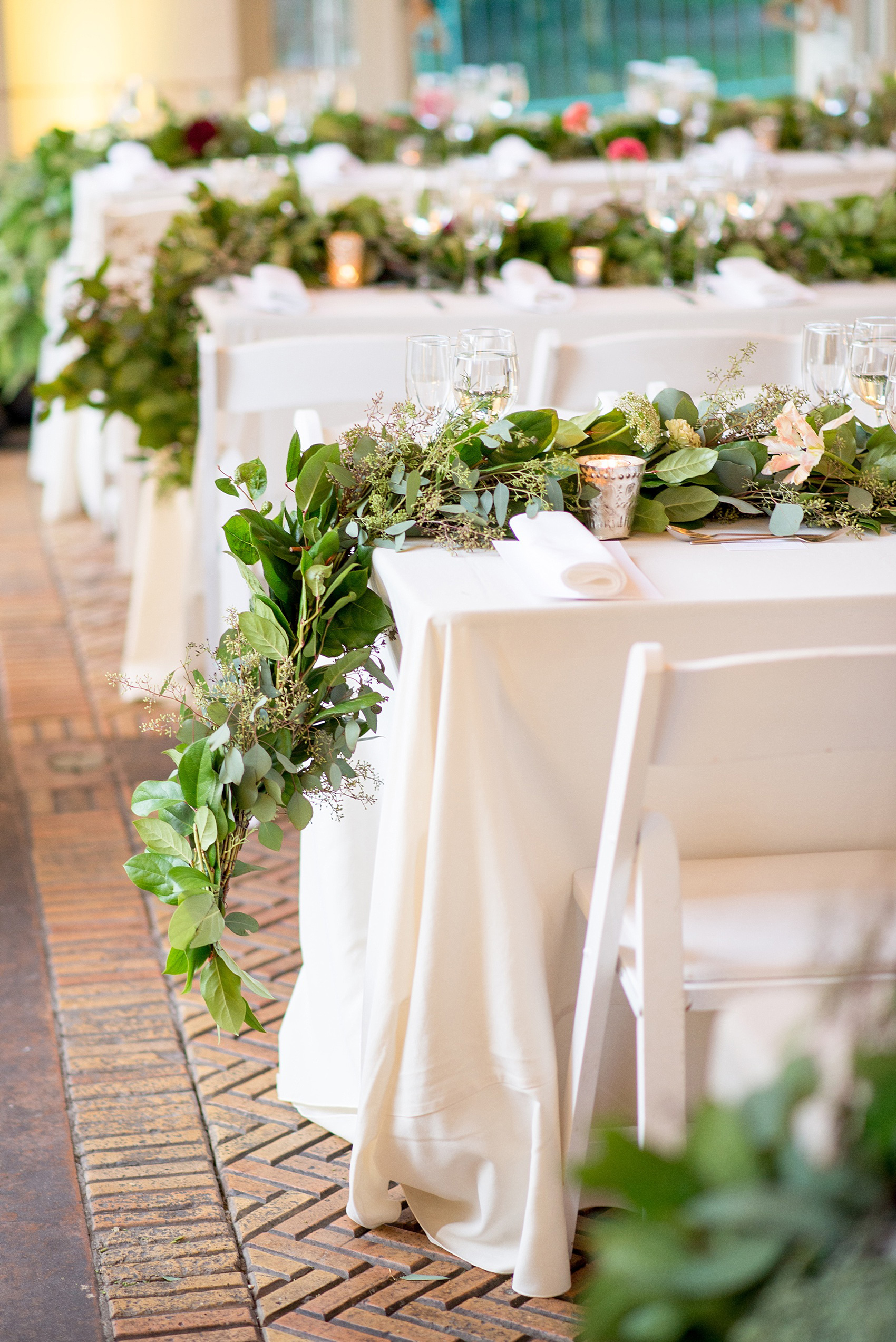 Mikkel Paige Photography photos of a wedding at Brooklyn's Prospect Park Boathouse with floral garland by Sachi Rose.