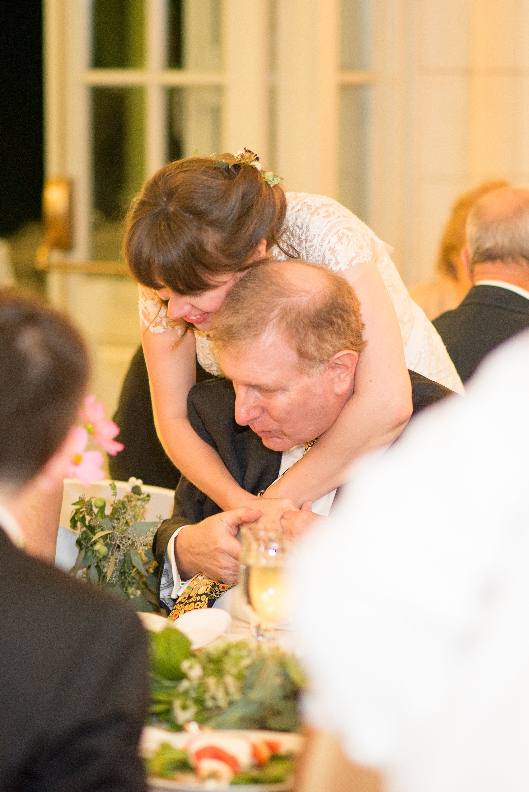 Mikkel Paige Photography photos of a wedding at Brooklyn's Prospect Park Boathouse. The bride hugs her father.