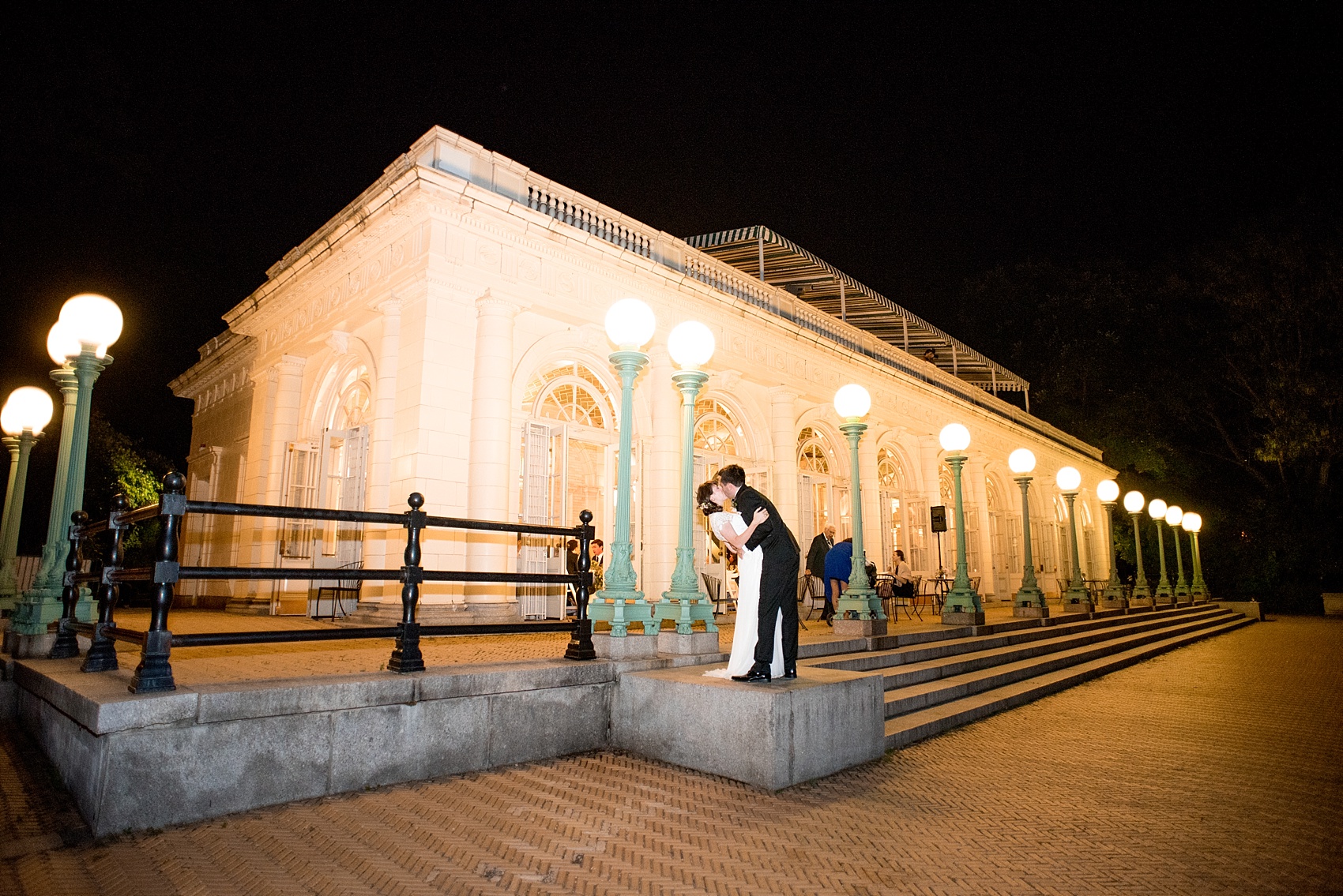 Mikkel Paige Photography photos of a wedding at Brooklyn's Prospect Park Boathouse in NYC. A night picture of the bride and groom outside the venue finishes the evening.