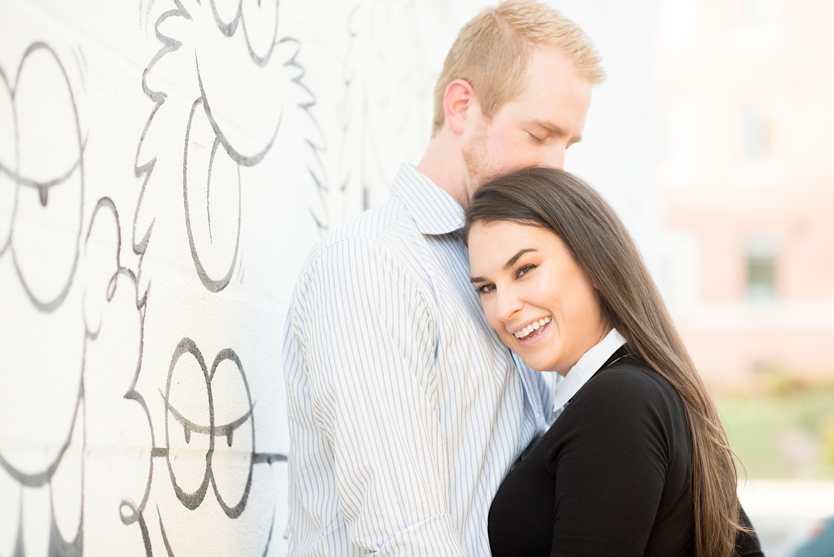 Mikkel Paige Photography photos of a downtown Raleigh engagement session with comical, fun murals.