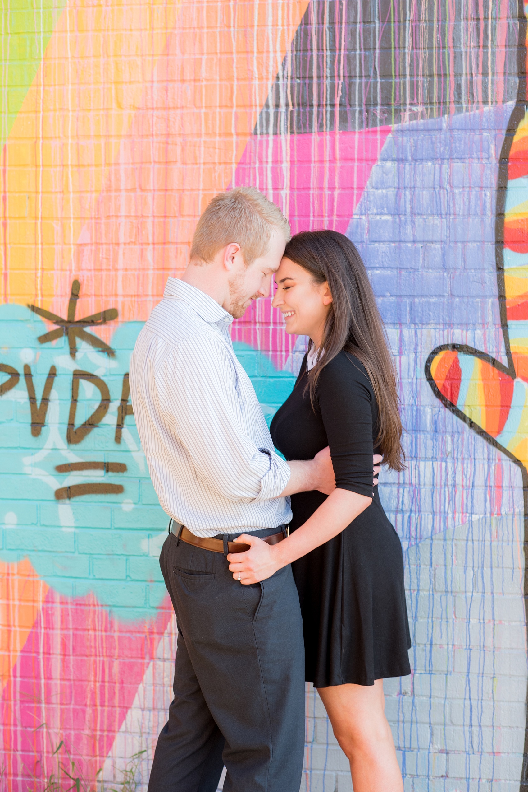 Mikkel Paige Photography photos of a colorful downtown Raleigh engagement session.